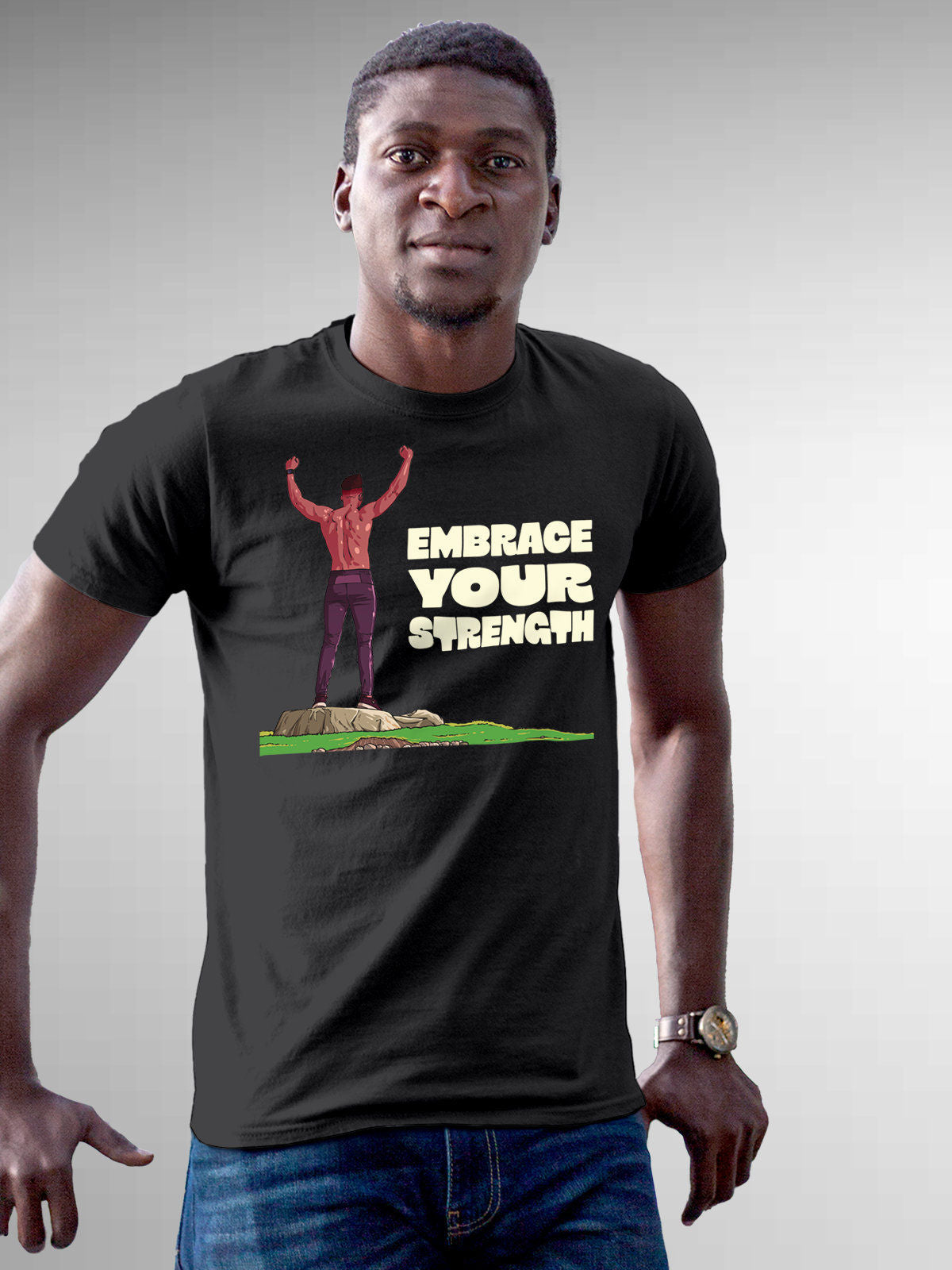Model wearing Men's Dark Grey Round Neck T-shirt with 'Embrace Your Strength' design, offering effortless style and premium comfort