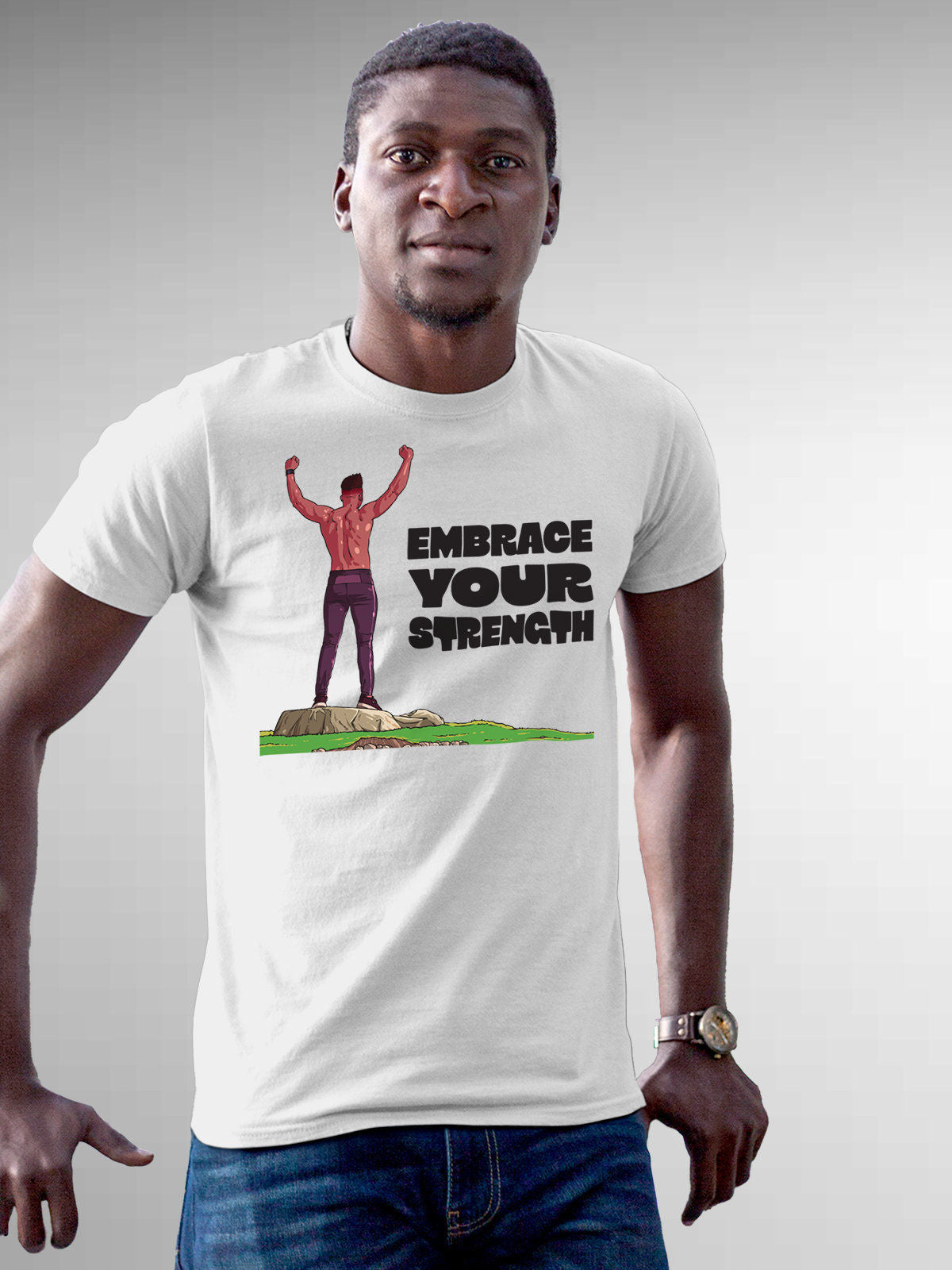 Model wearing Men's White Round Neck T-shirt with 'Embrace Your Strength' design, offering effortless style and premium comfort
