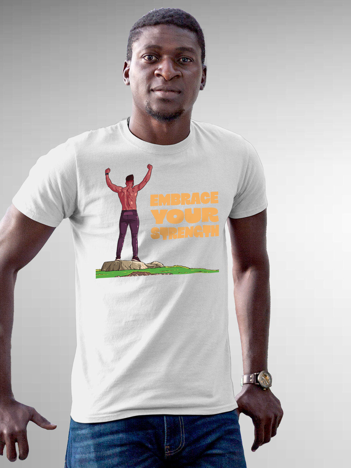 Model wearing Men's White Round Neck T-shirt with 'Embrace Your Strength' design, offering effortless style and premium comfort