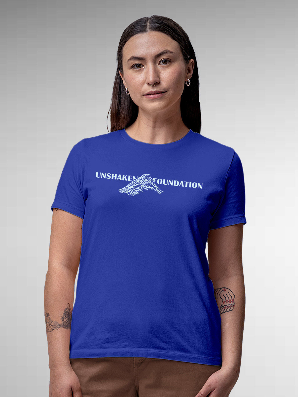 Model wearing Women's Blue Round Neck T-shirt with 'Unshaken Foundation' design, offering effortless style and premium comfort