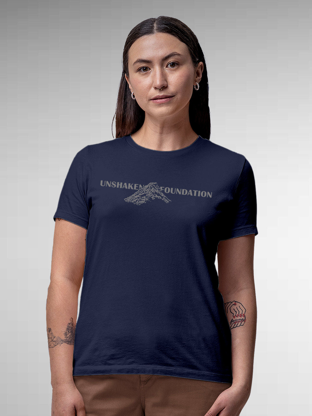 Model wearing Women's Navy Blue Round Neck T-shirt with 'Unshaken Foundation' design, offering effortless style and premium comfort