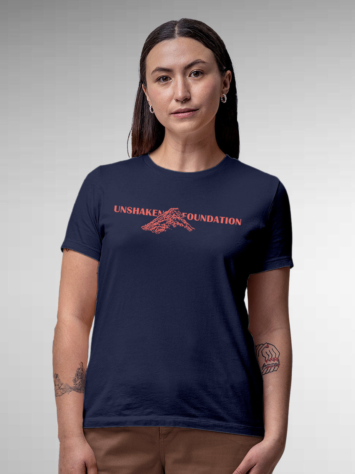 Model wearing Women's Navy Blue Round Neck T-shirt with 'Unshaken Foundation' design, offering effortless style and premium comfort