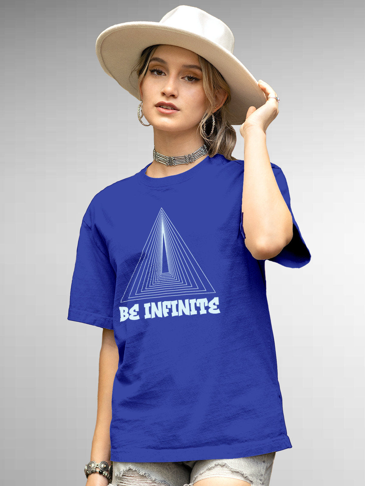 Model wearing Women's Blue Round Neck T-shirt with 'Be Infinite' design, offering effortless style and premium comfort