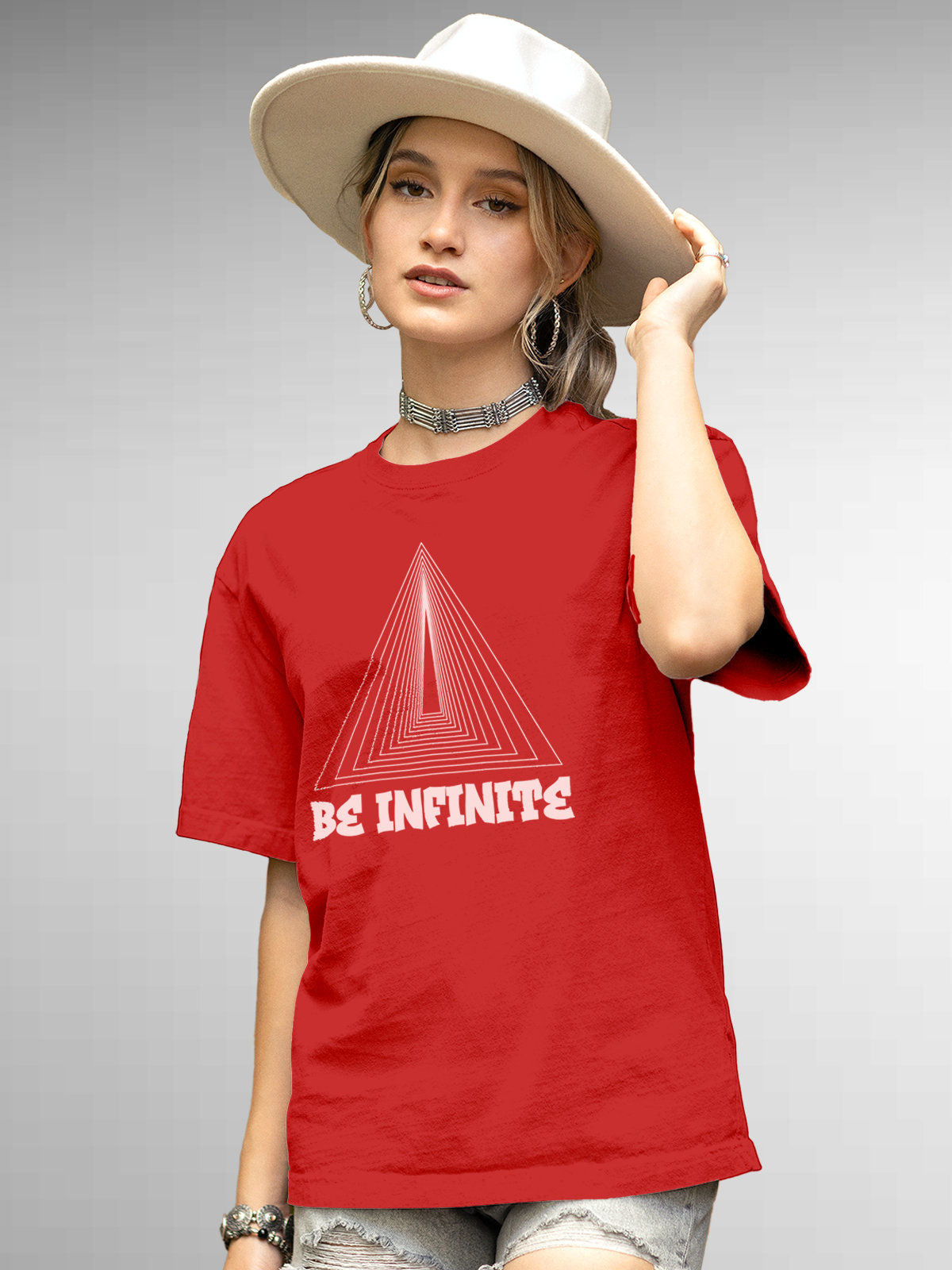 Model wearing Women's Red Round Neck T-shirt with 'Be Infinite' design, offering effortless style and premium comfort