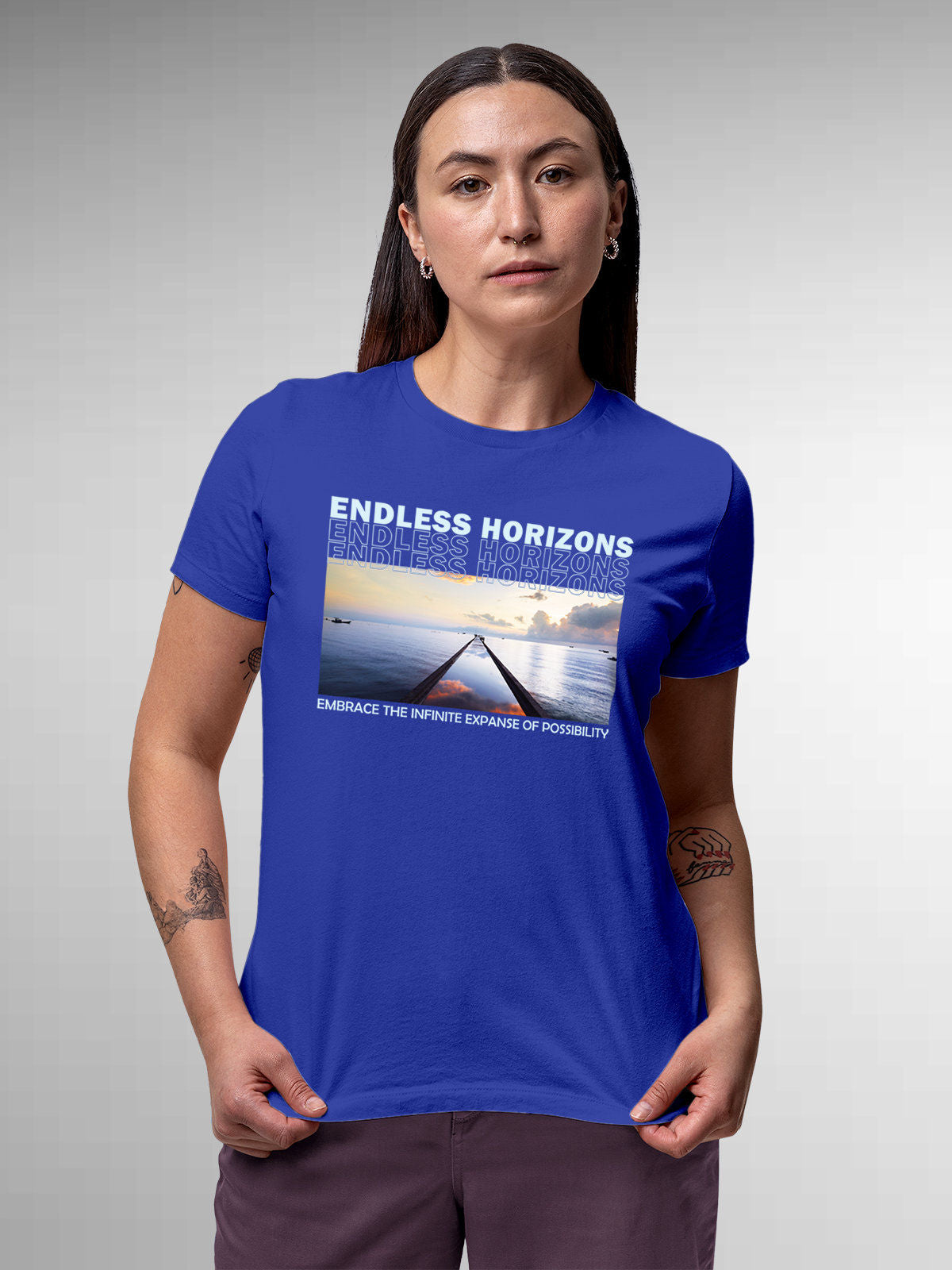 Model wearing Women's Blue Round Neck T-shirt with 'Endless Horizons' design, offering effortless style and premium comfort
