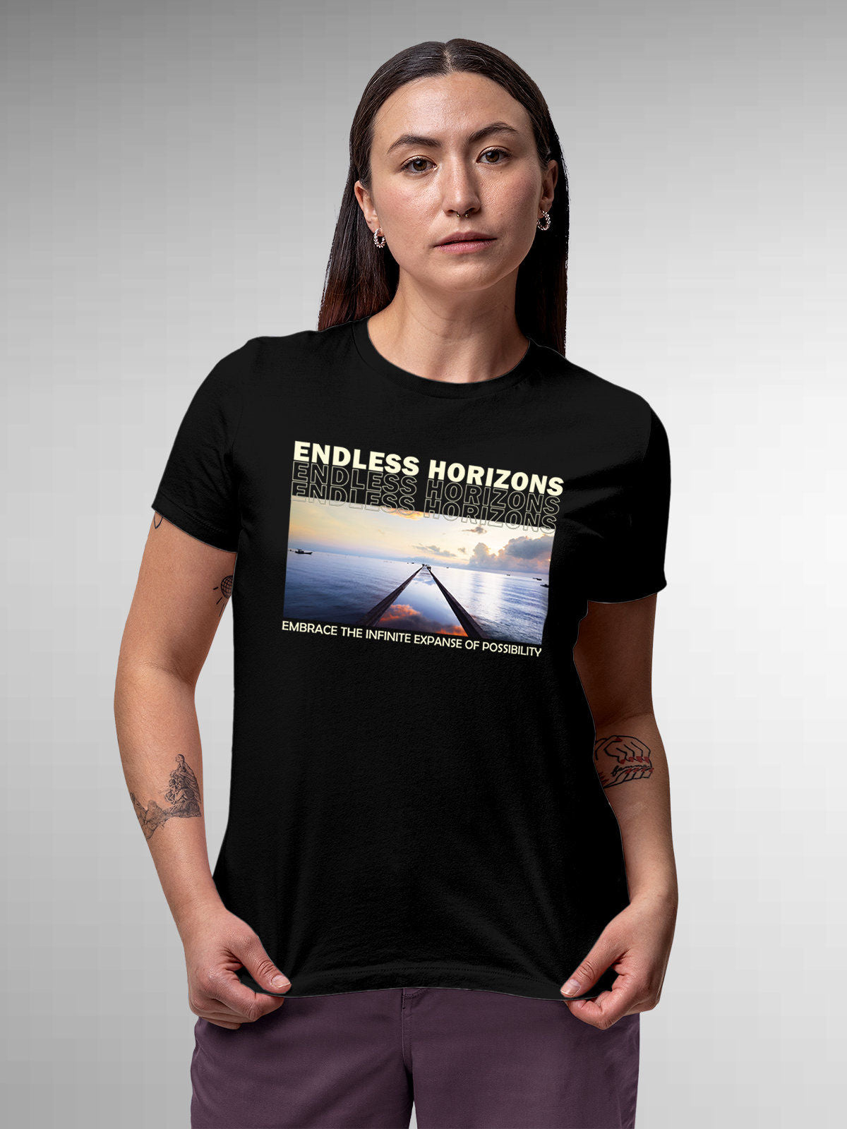 Model wearing Women's Black Round Neck T-shirt with 'Endless Horizons' design, offering effortless style and premium comfort