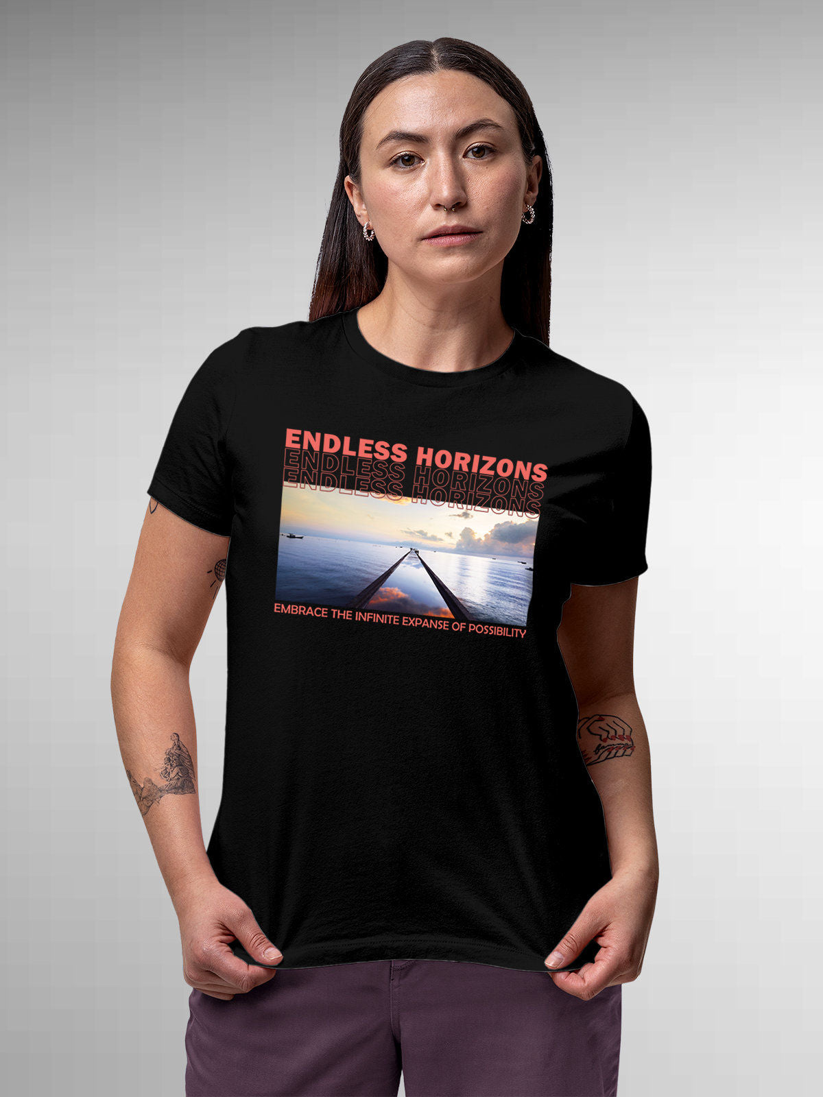 Model wearing Women's Black Round Neck T-shirt with 'Endless Horizons' design, offering effortless style and premium comfort