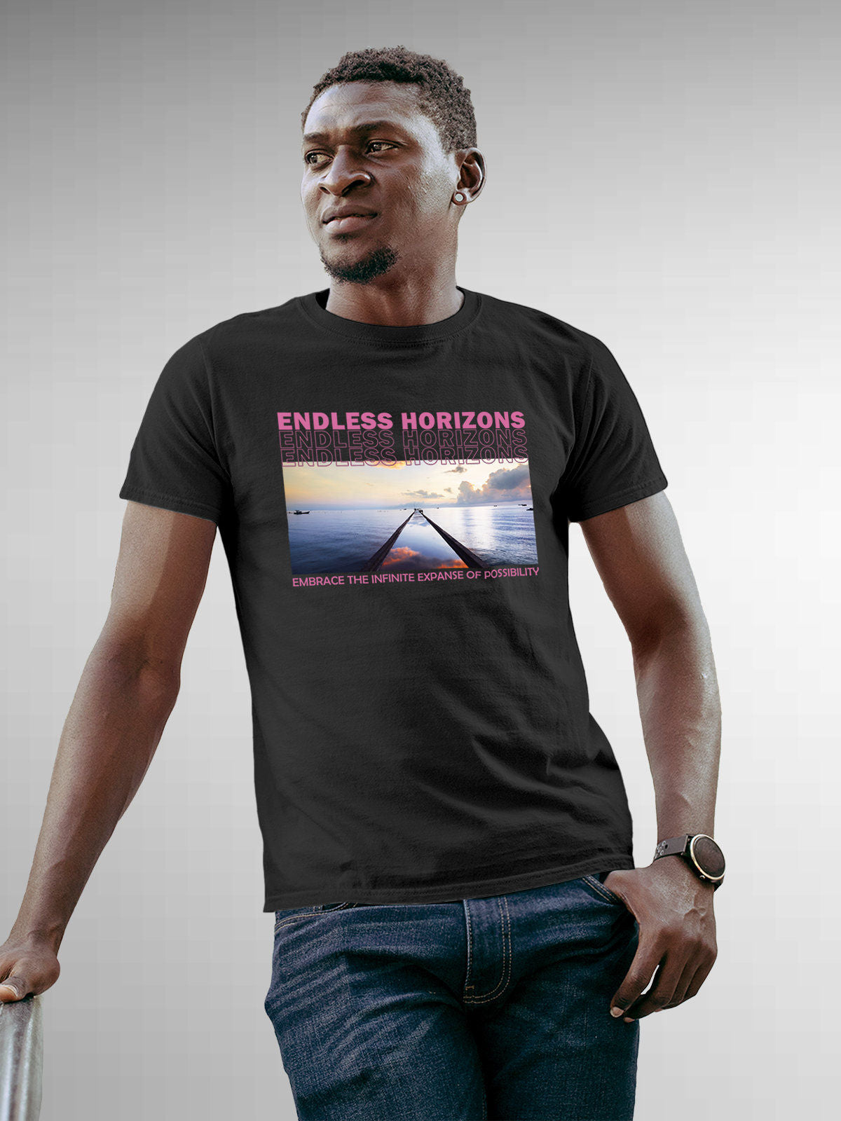 Model wearing Men's Dark Grey Round Neck T-shirt with 'Endless Horizons' design, offering effortless style and premium comfort
