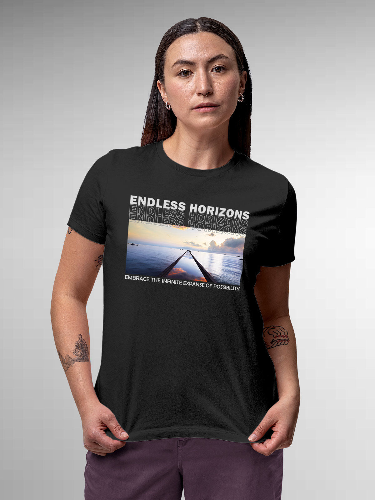 Model wearing Women's Dark Grey Round Neck T-shirt with 'Endless Horizons' design, offering effortless style and premium comfort