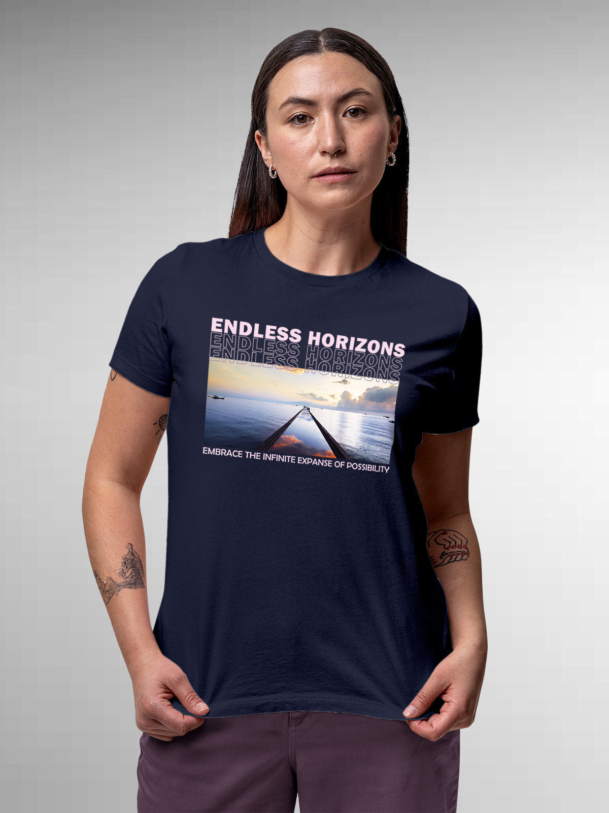 Model wearing Women's Navy Blue Round Neck T-shirt with 'Endless Horizons' design, offering effortless style and premium comfort