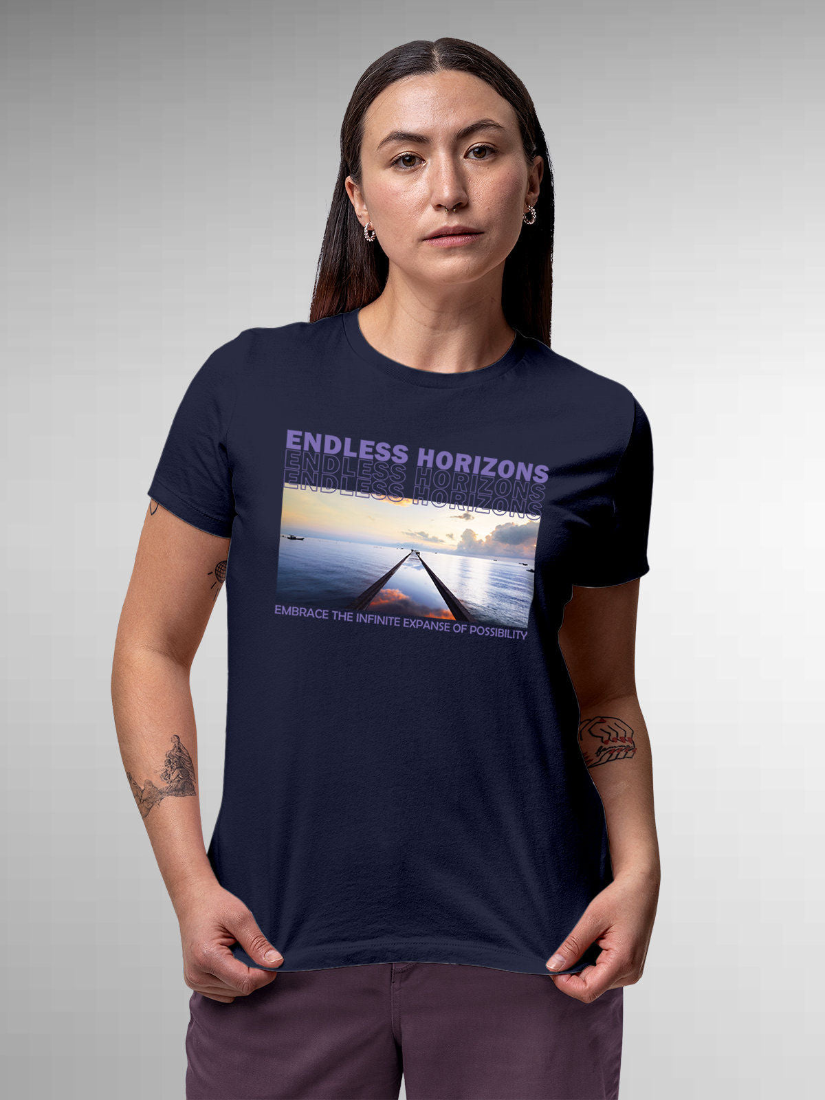 Model wearing Women's Navy Blue Round Neck T-shirt with 'Endless Horizons' design, offering effortless style and premium comfort