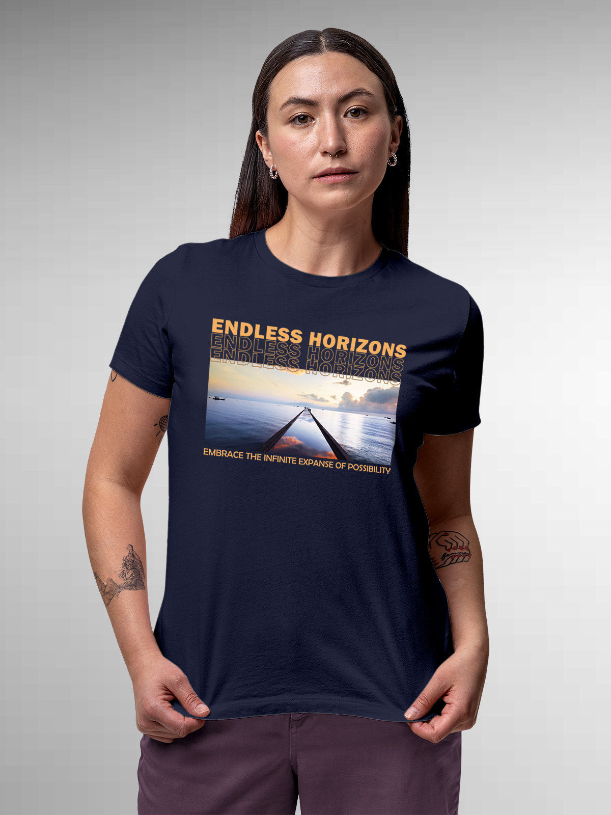 Model wearing Women's Navy Blue Round Neck T-shirt with 'Endless Horizons' design, offering effortless style and premium comfort
