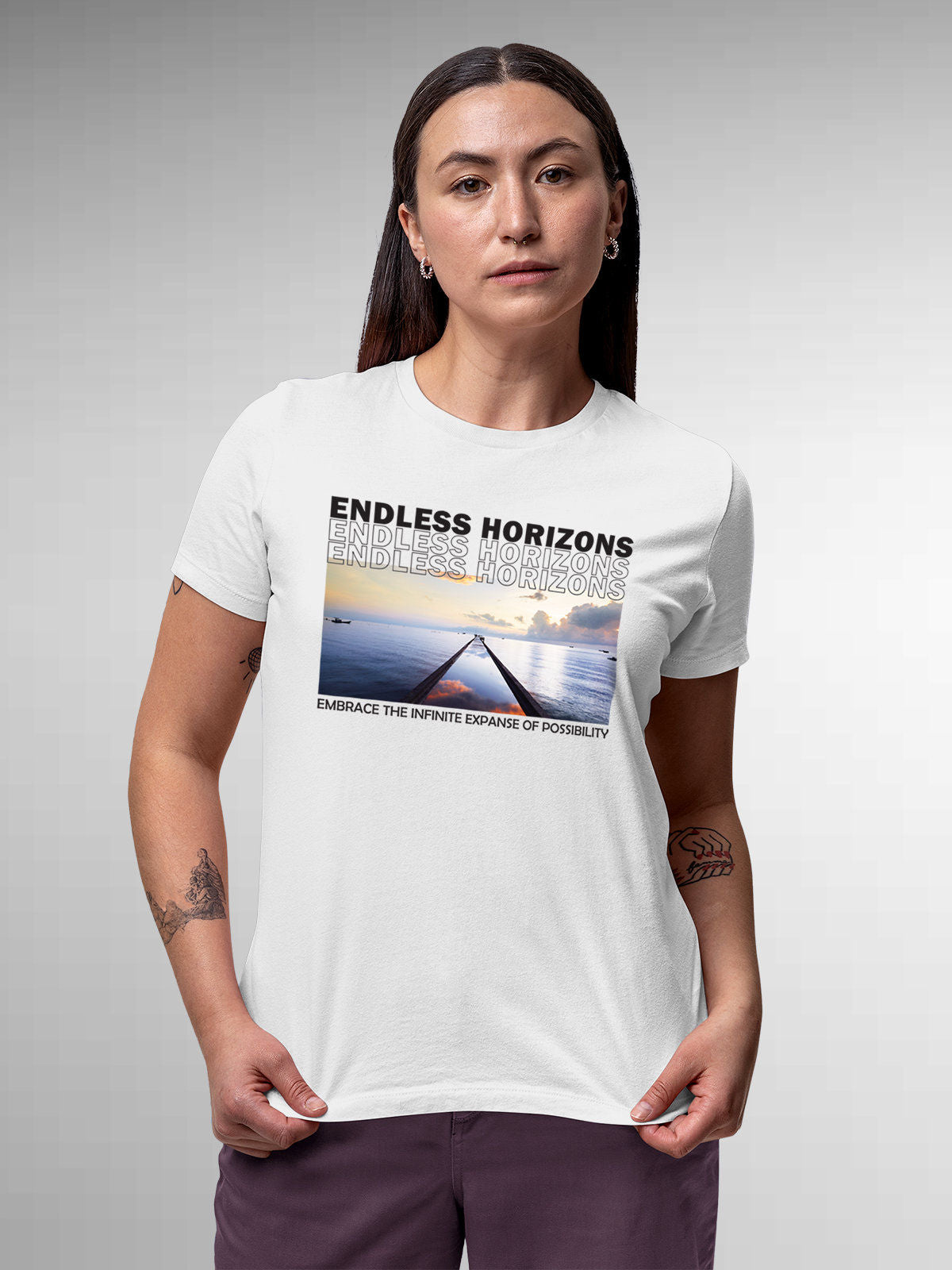 Model wearing Women's White Round Neck T-shirt with 'Endless Horizons' design, offering effortless style and premium comfort