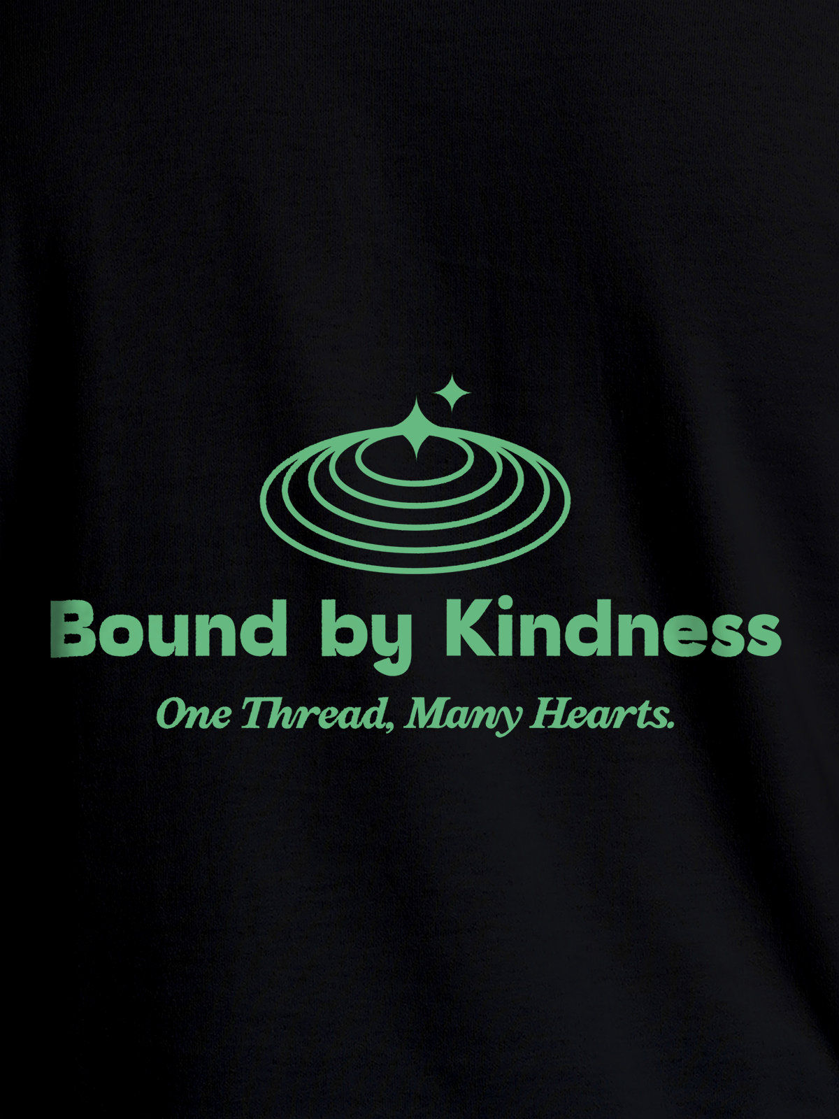 Close up of 'Bound By Kindness' design on Men's Black Round Neck T-shirt, highlighting intricate details and vibrant print.