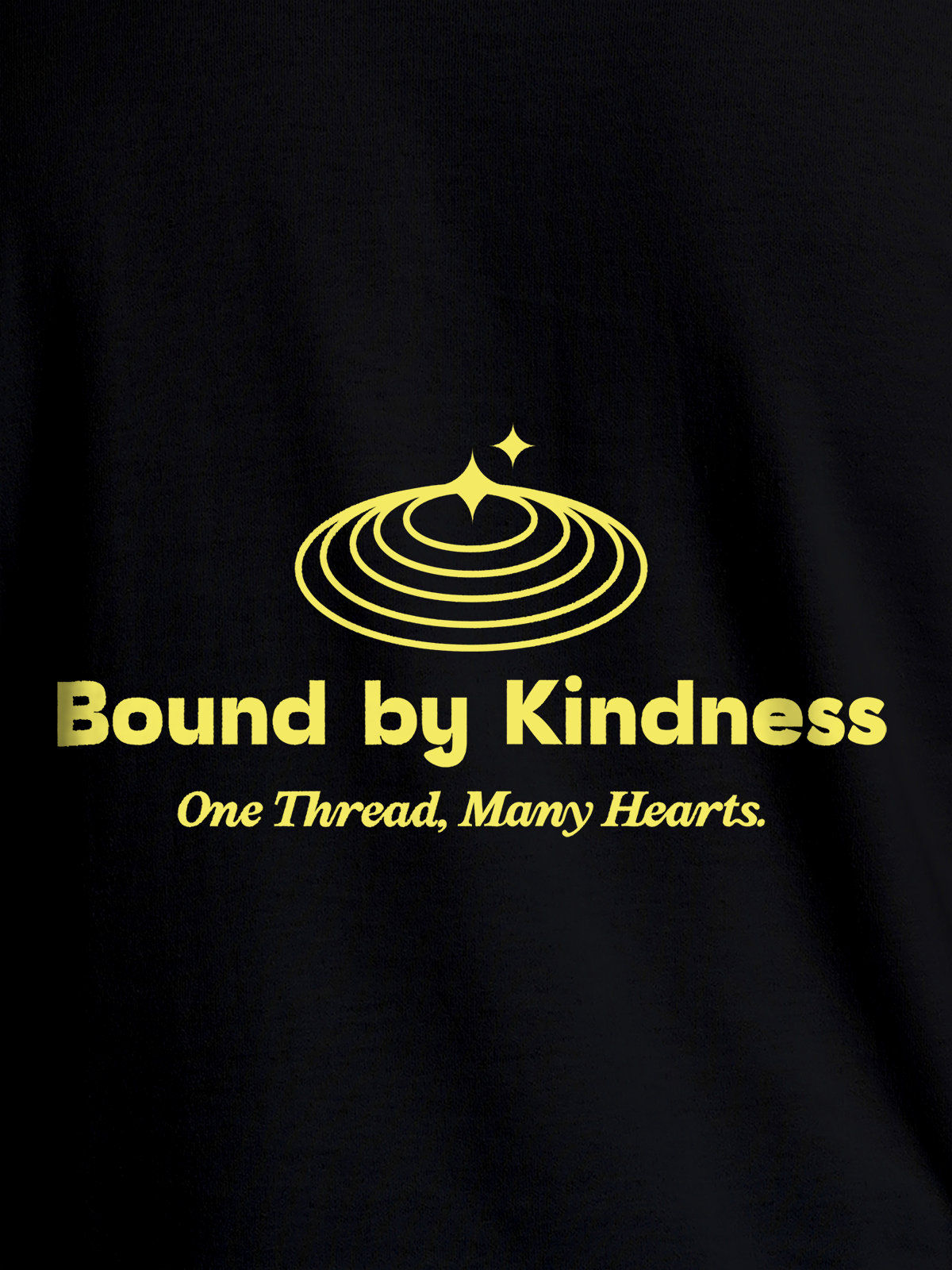 Close up of 'Bound By Kindness' design on Men's Black Round Neck T-shirt, highlighting intricate details and vibrant print.