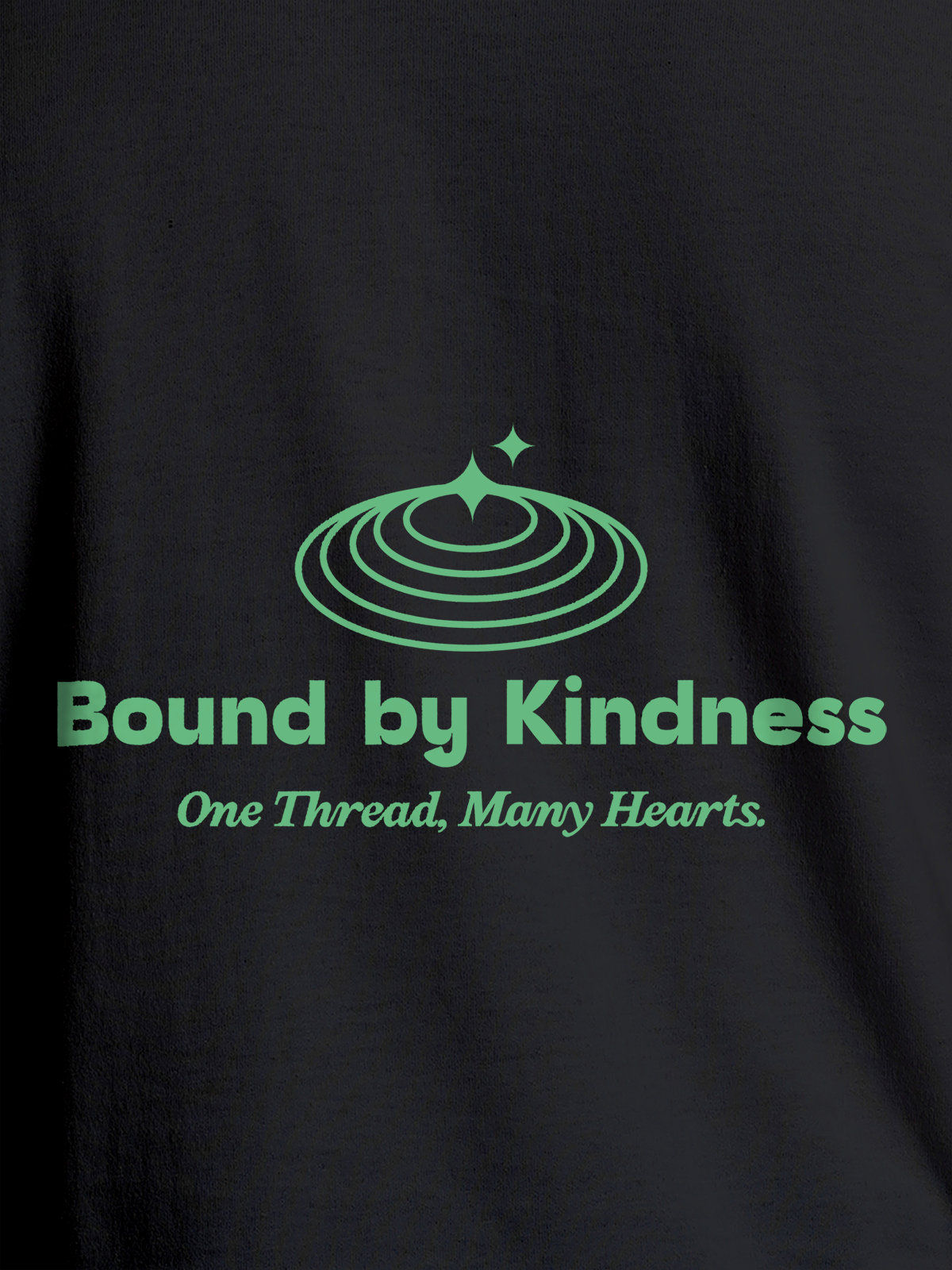 Close up of 'Bound By Kindness' design on Men's Dark Grey Round Neck T-shirt, highlighting intricate details and vibrant print.