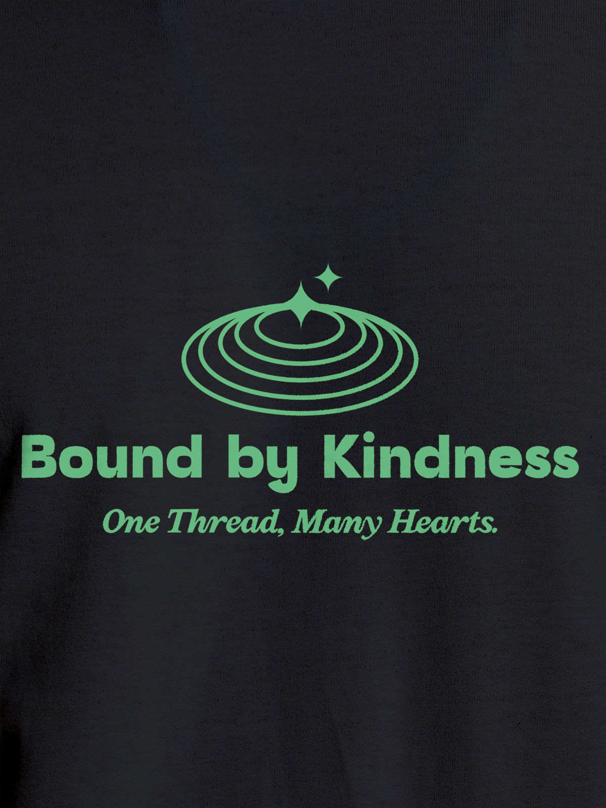 Close up of 'Bound By Kindness' design on Women's Dark Grey Round Neck T-shirt, highlighting intricate details and vibrant print.