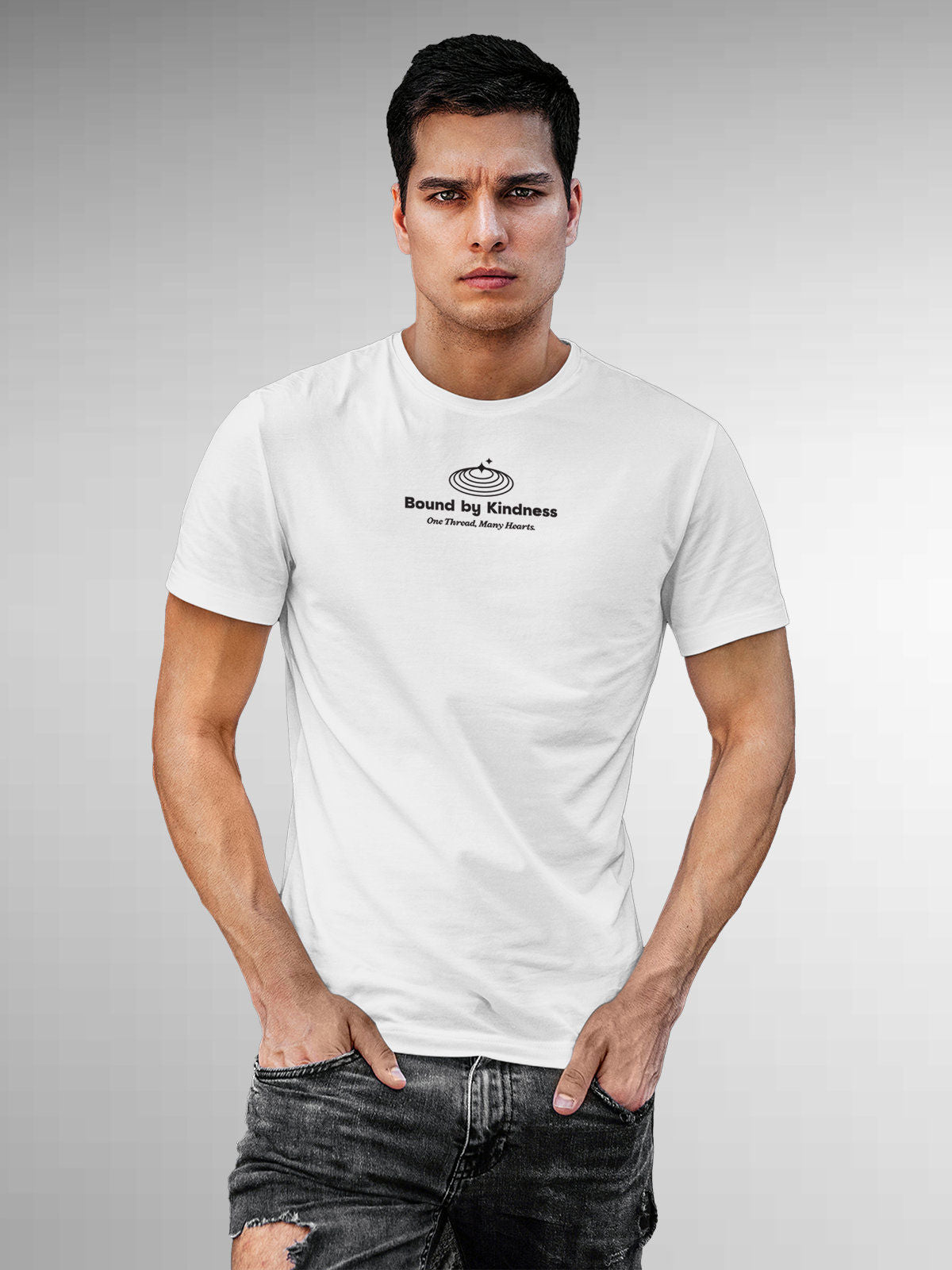 Model wearing Men's White Round Neck T-shirt with 'Bound By Kindness' design, offering effortless style and premium comfort