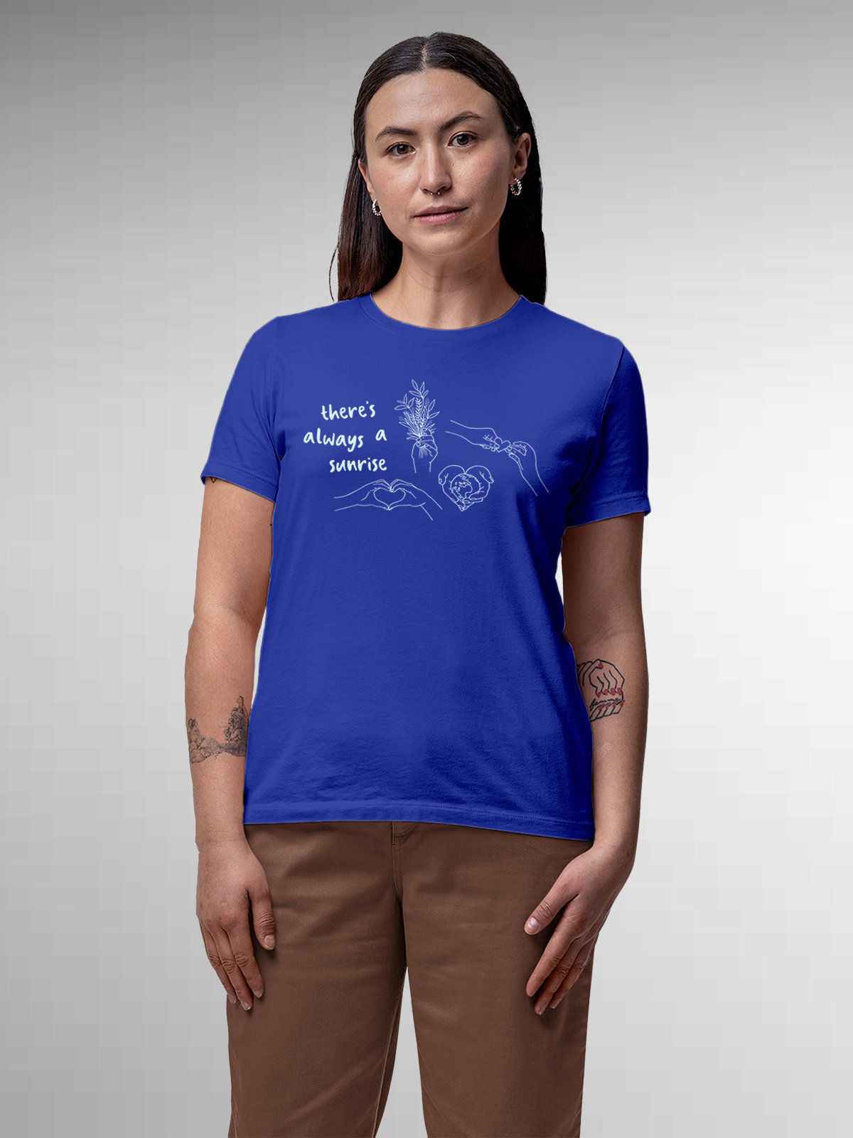 Model wearing Women's Blue Round Neck T-shirt with 'There's Always a Sunrise' design, offering effortless style and premium comfort