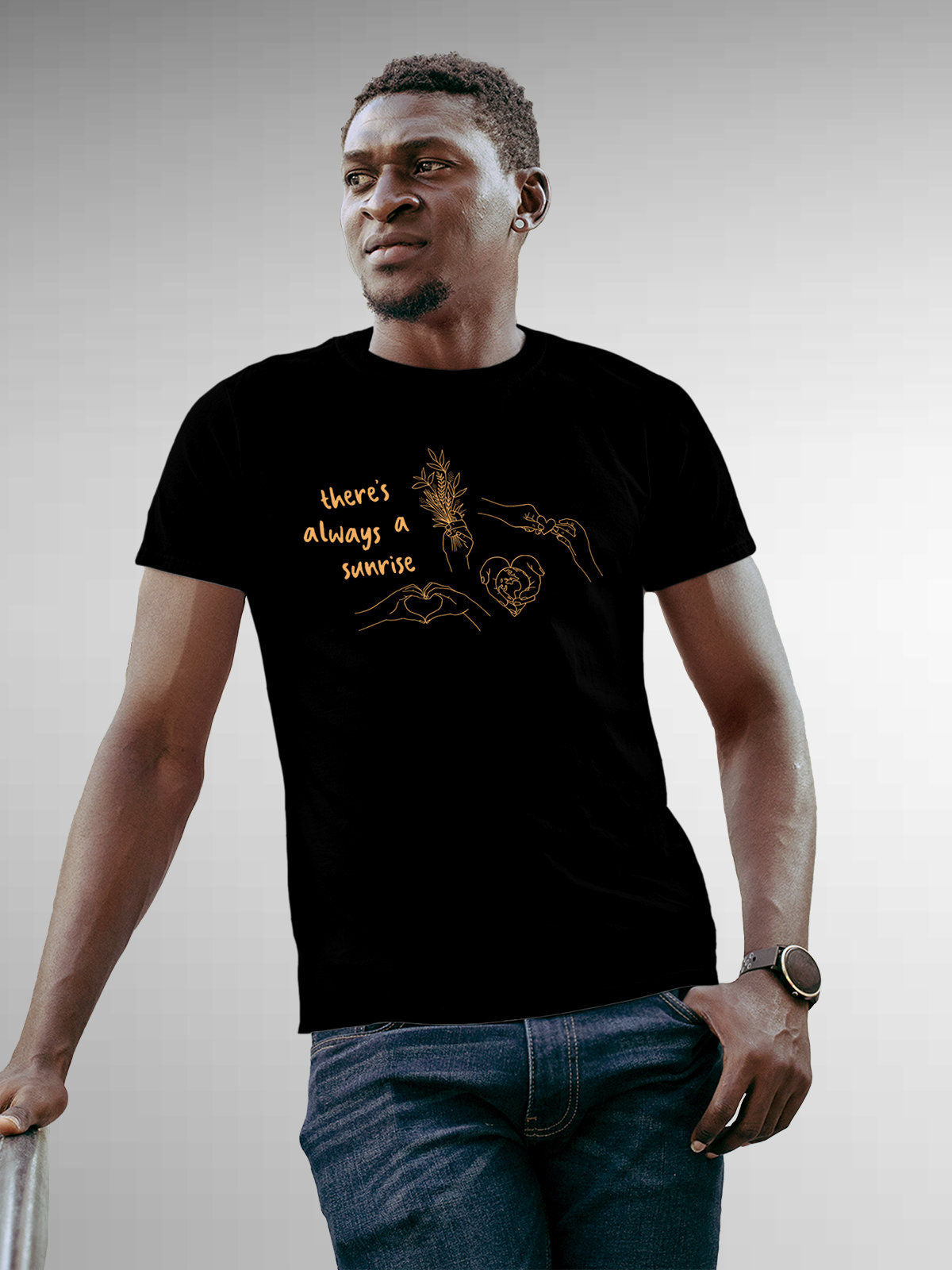 Model wearing Men's Black Round Neck T-shirt with 'There's Always a Sunrise' design, offering effortless style and premium comfort