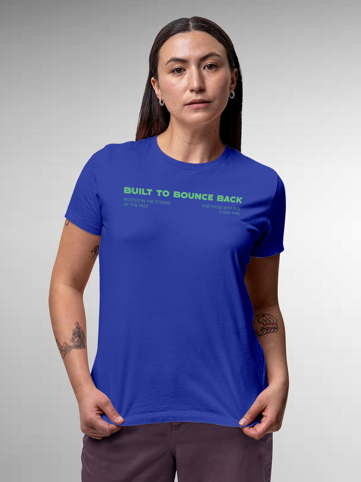 Model wearing Women's Blue Round Neck T-shirt with 'Built To Bounce Back' design, offering effortless style and premium comfort