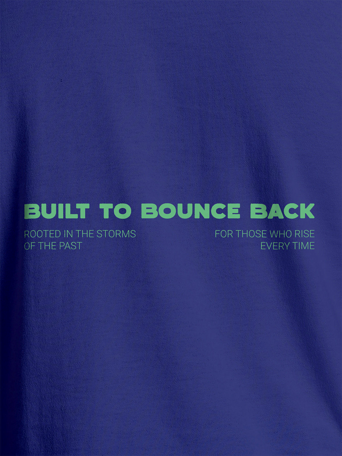 Close up of 'Built To Bounce Back' design on Women's Blue Round Neck T-shirt, highlighting intricate details and vibrant print.
