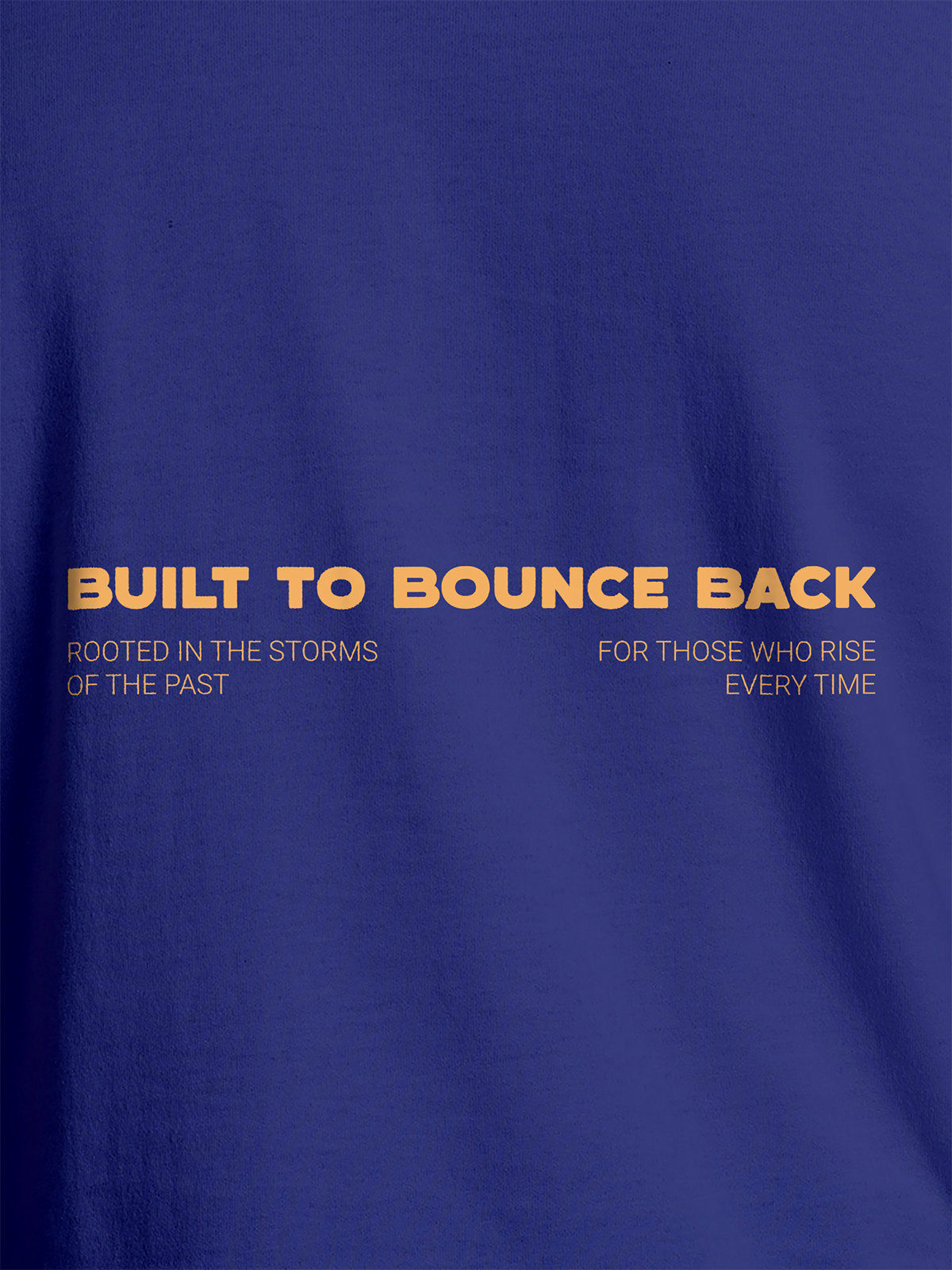 Close up of 'Built To Bounce Back' design on Women's Blue Round Neck T-shirt, highlighting intricate details and vibrant print.
