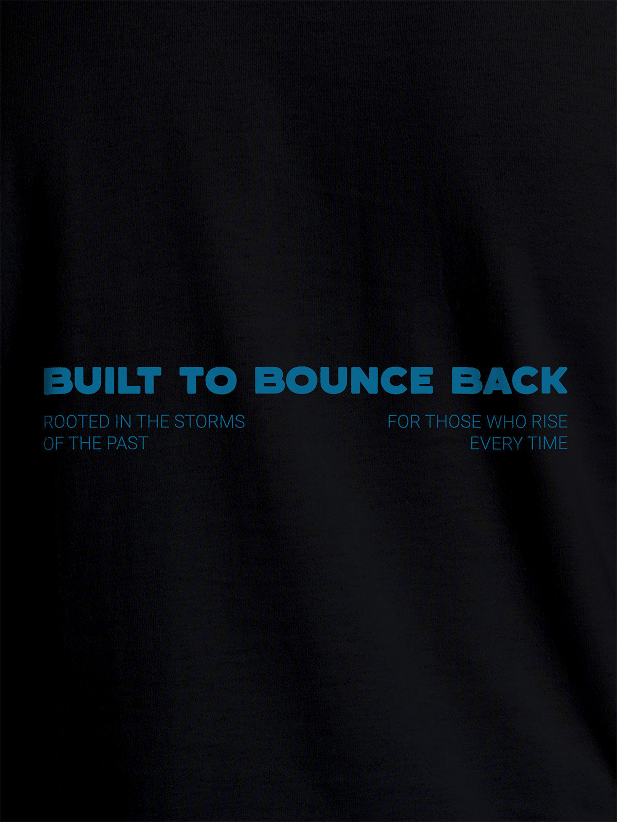 Close up of 'Built To Bounce Back' design on Women's Black Round Neck T-shirt, highlighting intricate details and vibrant print.