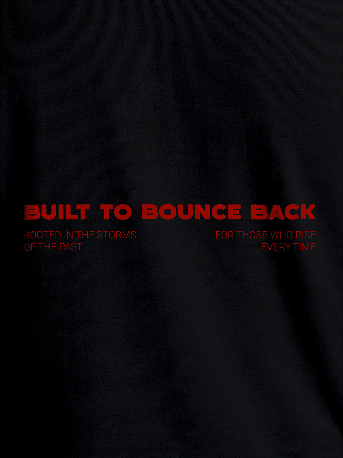 Close up of 'Built To Bounce Back' design on Women's Black Round Neck T-shirt, highlighting intricate details and vibrant print.