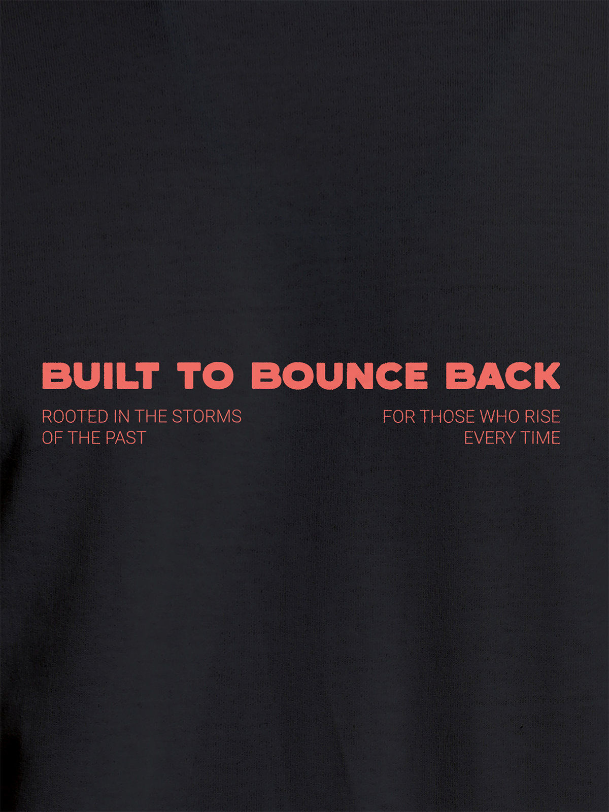 Close up of 'Built To Bounce Back' design on Men's Dark Grey Round Neck T-shirt, highlighting intricate details and vibrant print.