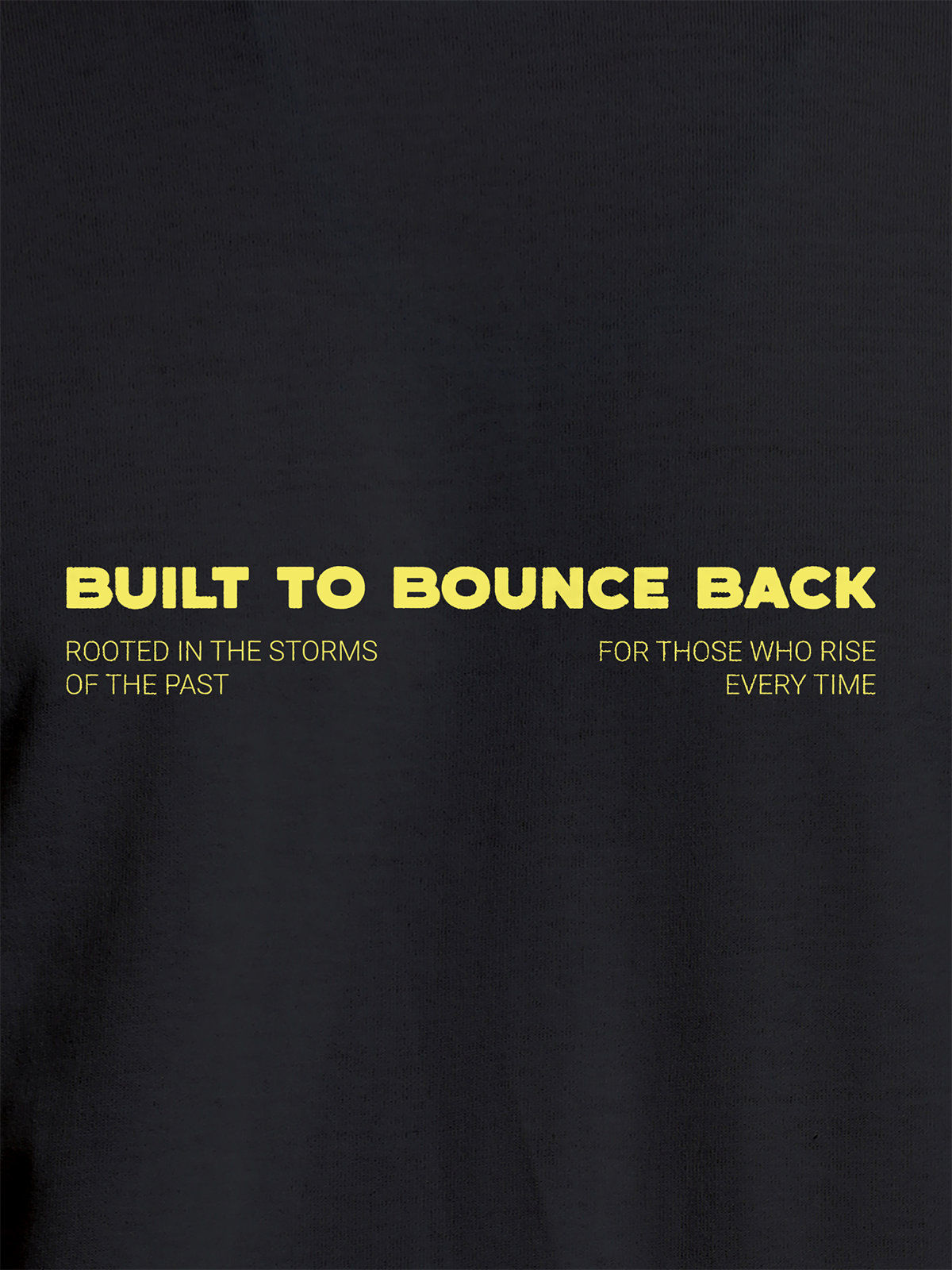 Close up of 'Built To Bounce Back' design on Men's Dark Grey Round Neck T-shirt, highlighting intricate details and vibrant print.