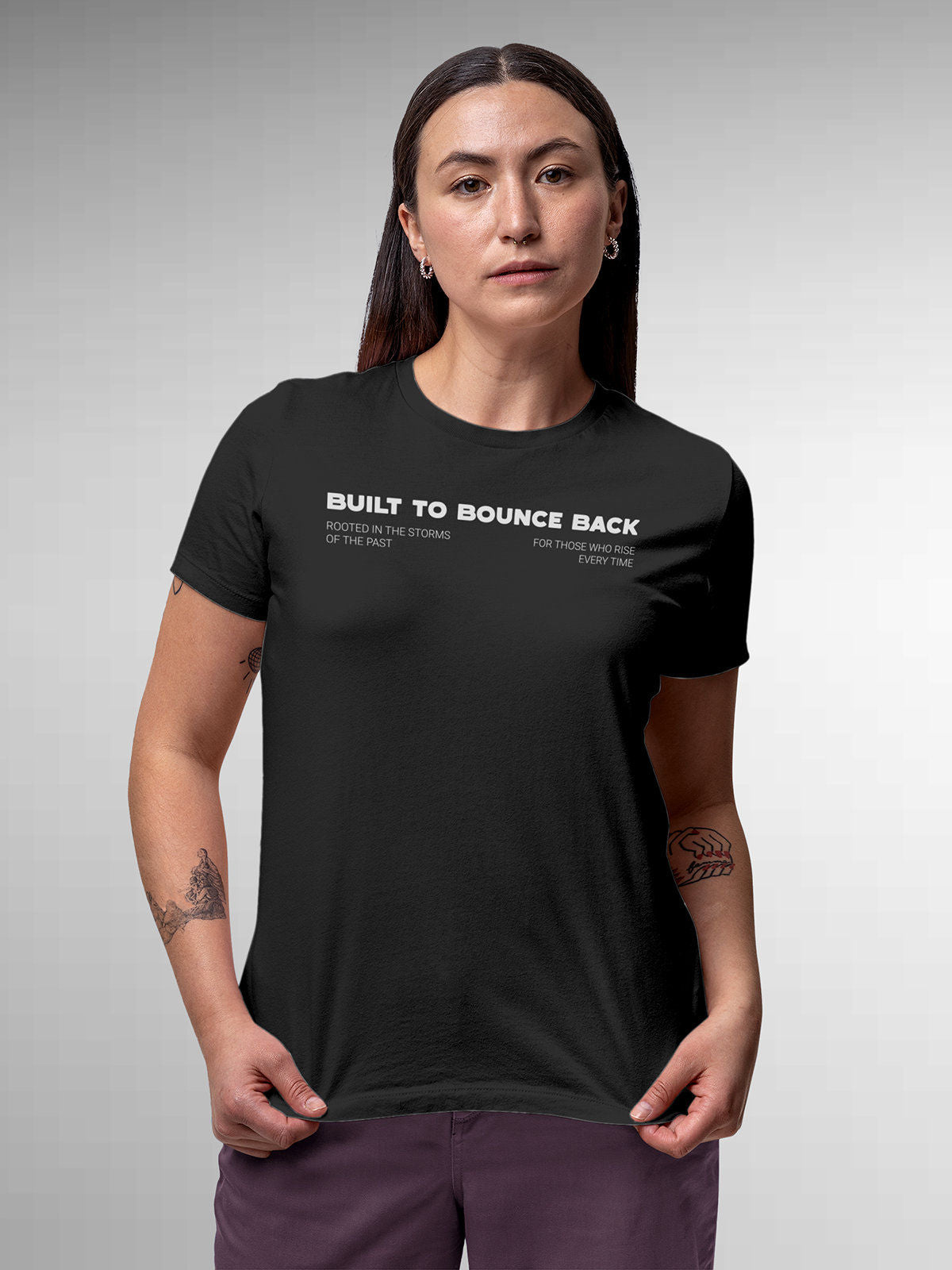 Model wearing Women's Dark Grey Round Neck T-shirt with 'Built To Bounce Back' design, offering effortless style and premium comfort