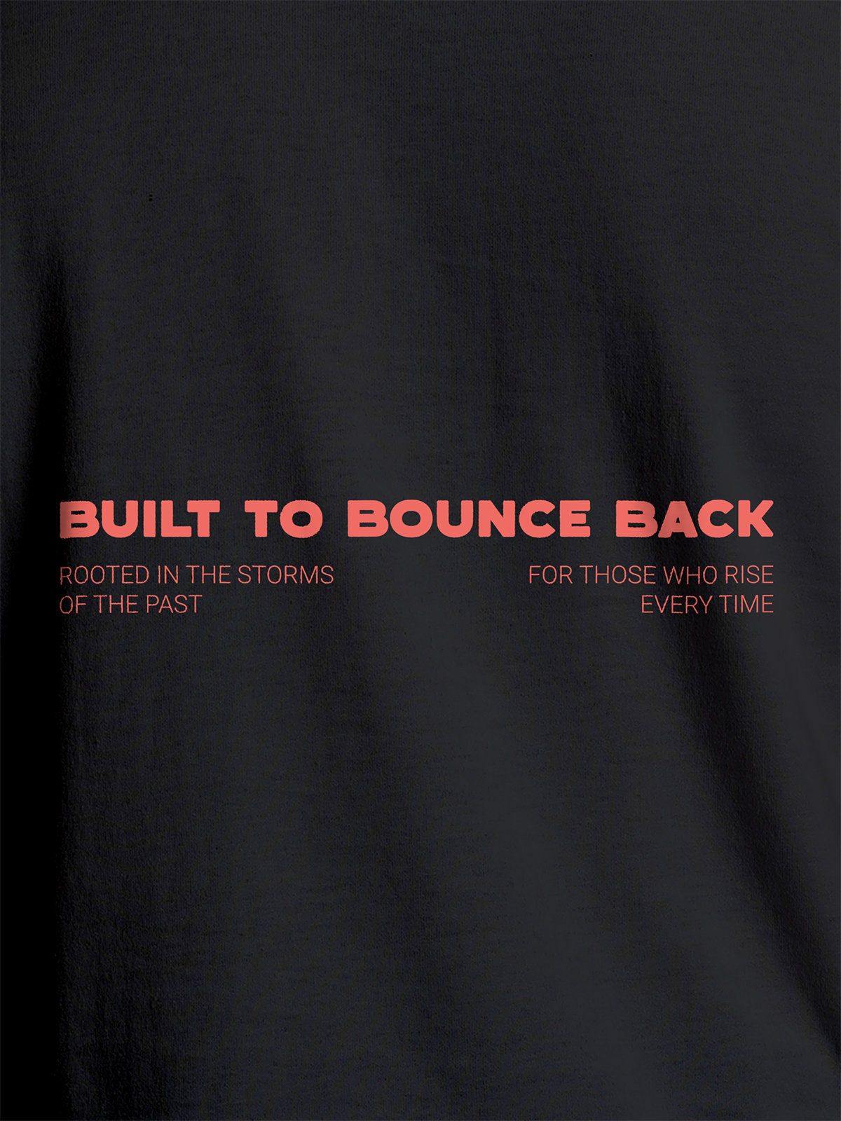 Close up of 'Built To Bounce Back' design on Women's Dark Grey Round Neck T-shirt, highlighting intricate details and vibrant print.