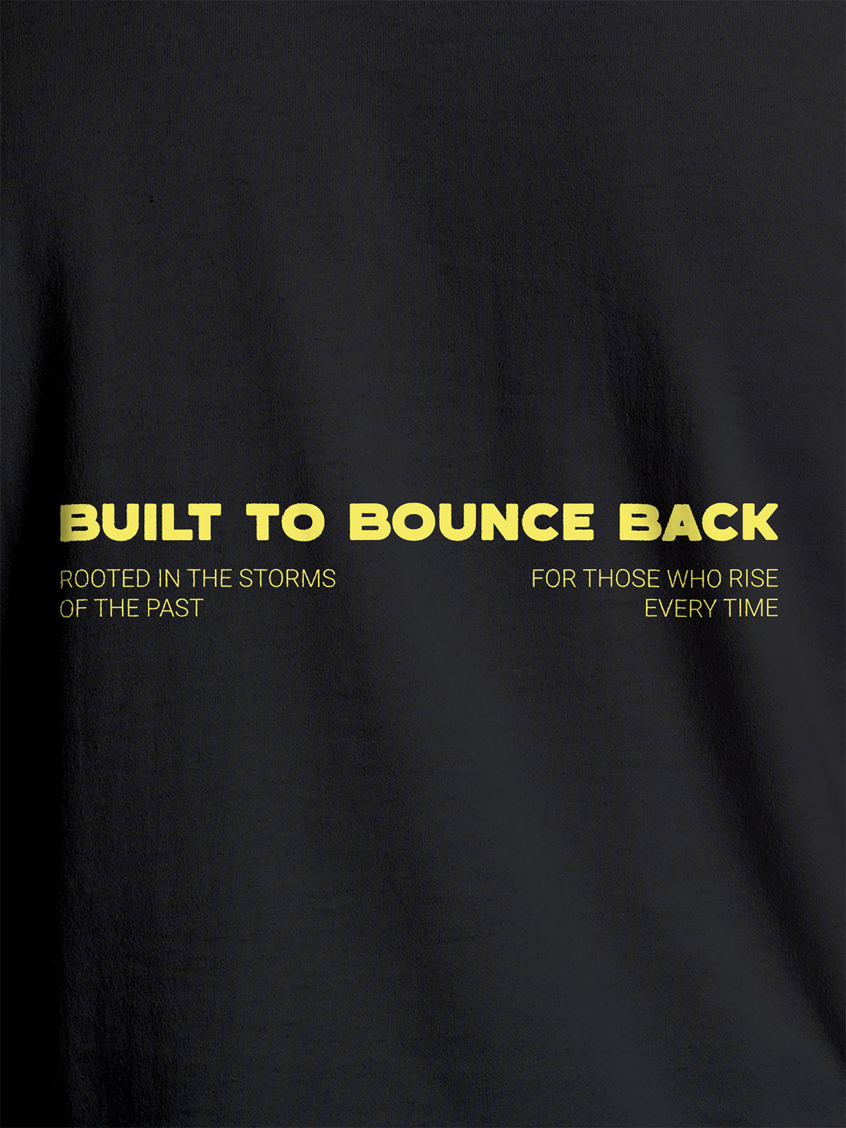 Close up of 'Built To Bounce Back' design on Women's Dark Grey Round Neck T-shirt, highlighting intricate details and vibrant print.