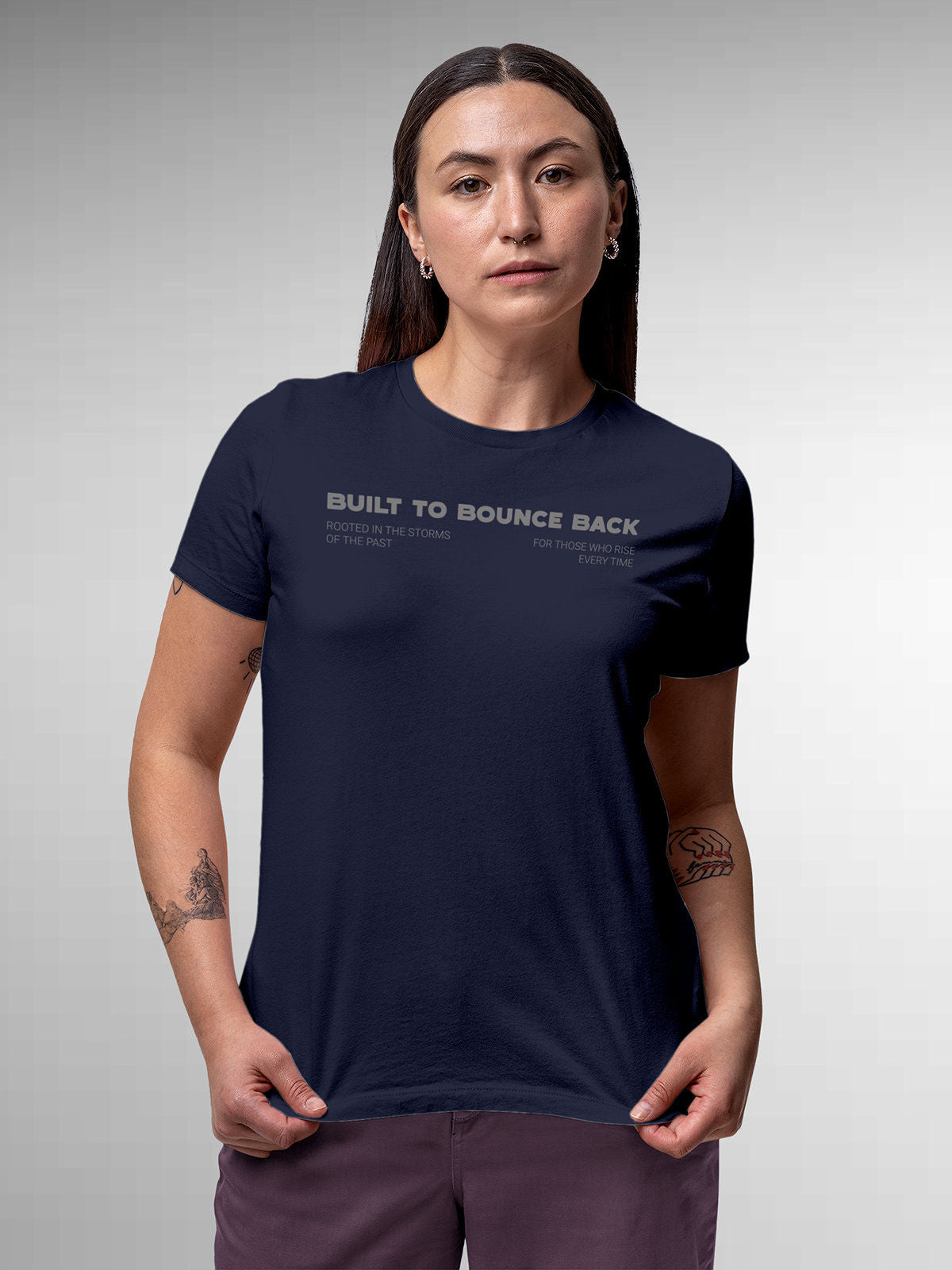Model wearing Women's Navy Blue Round Neck T-shirt with 'Built To Bounce Back' design, offering effortless style and premium comfort