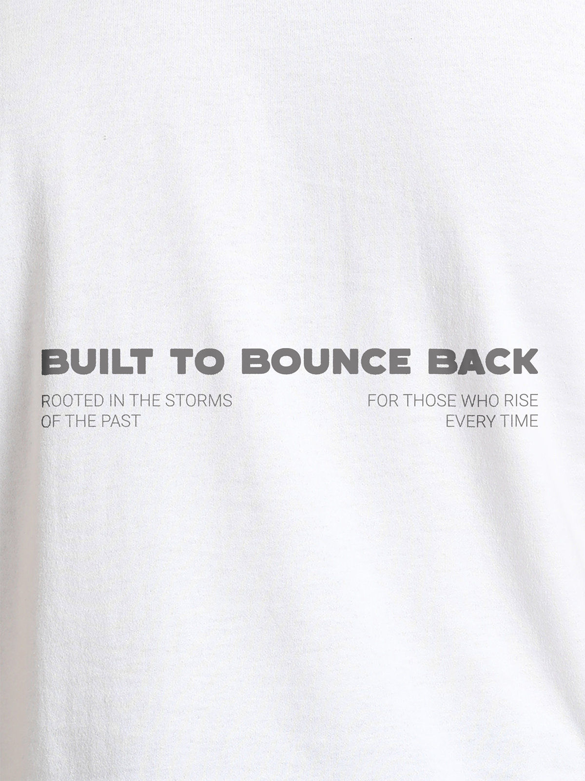 Close up of 'Built To Bounce Back' design on Women's White Round Neck T-shirt, highlighting intricate details and vibrant print.