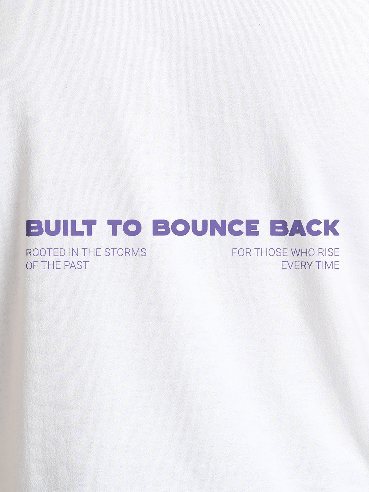 Close up of 'Built To Bounce Back' design on Women's White Round Neck T-shirt, highlighting intricate details and vibrant print.