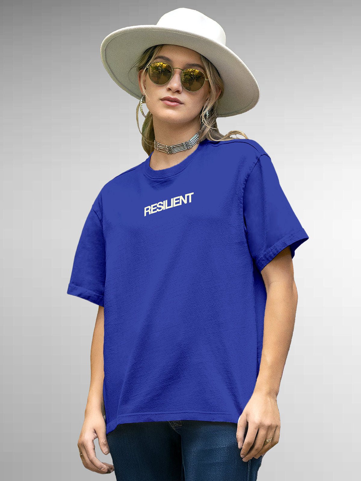 Model wearing Women's Blue Round Neck T-shirt with 'Resilient' design, offering effortless style and premium comfort