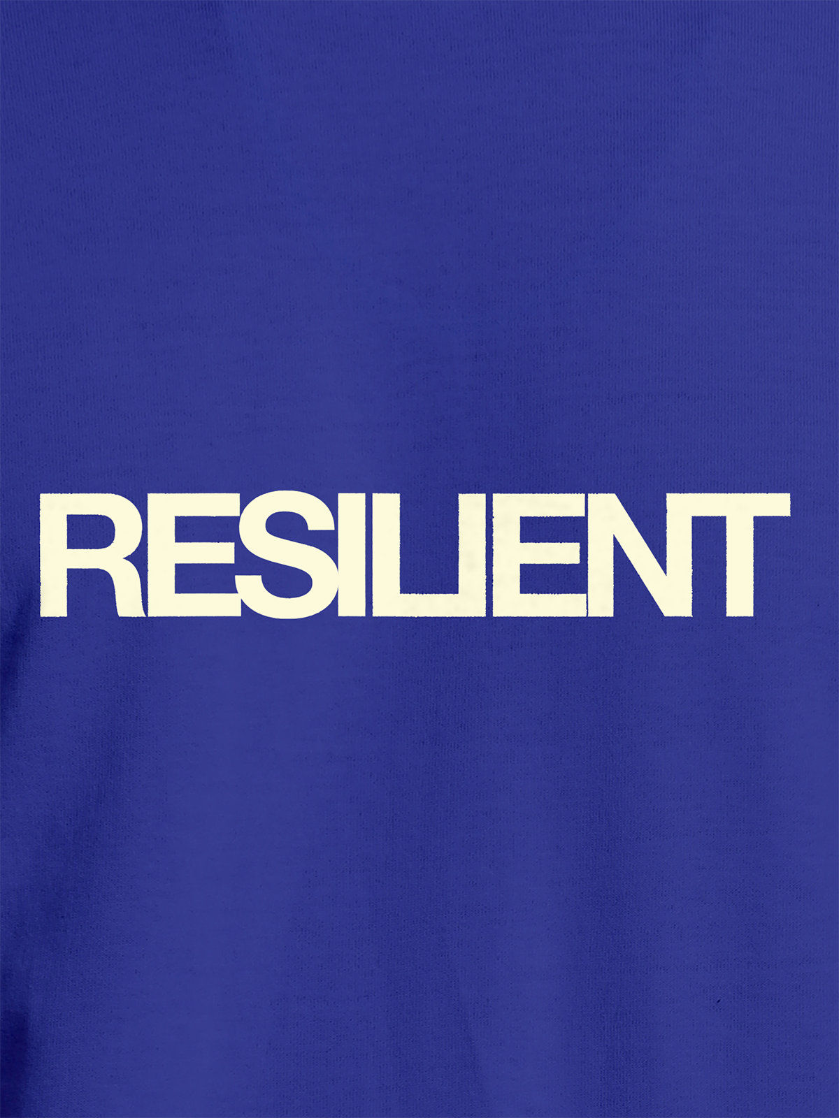 Close up of 'Resilient' design on Women's Blue Round Neck T-shirt, highlighting intricate details and vibrant print.