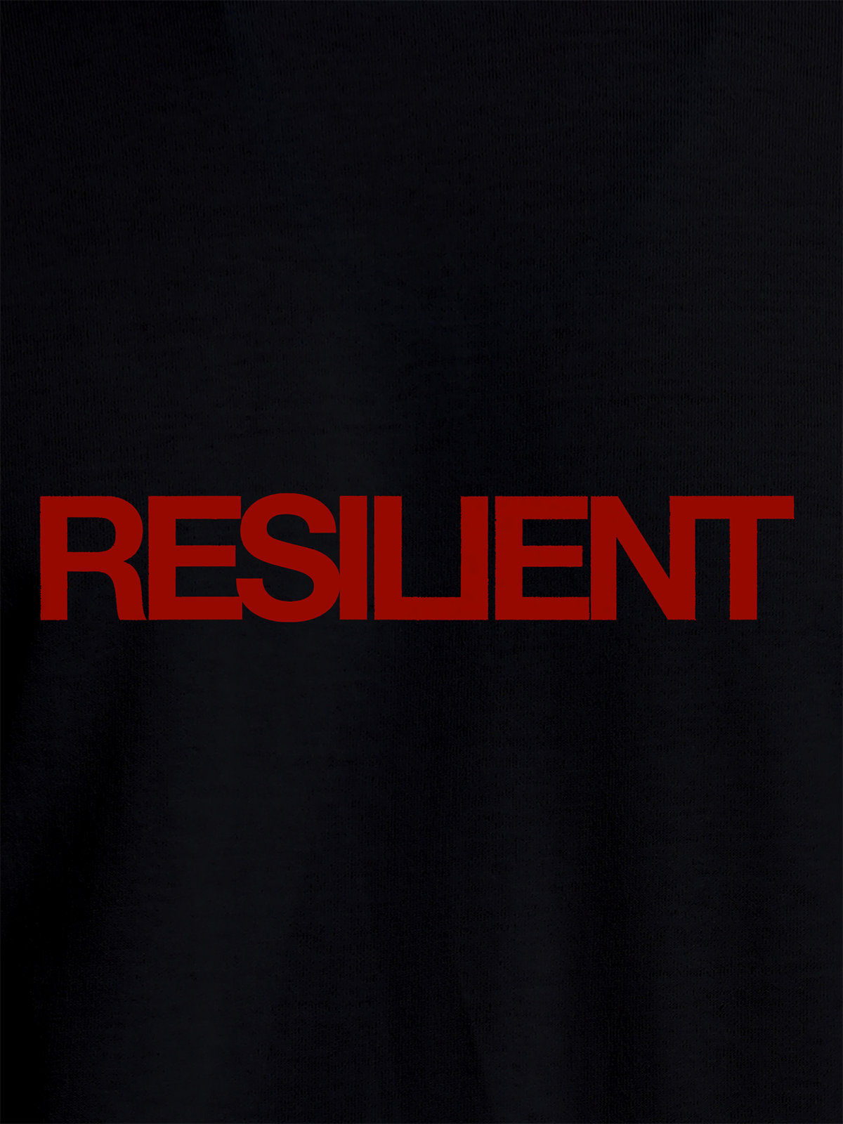 Close up of 'Resilient' design on Women's Black Round Neck T-shirt, highlighting intricate details and vibrant print.