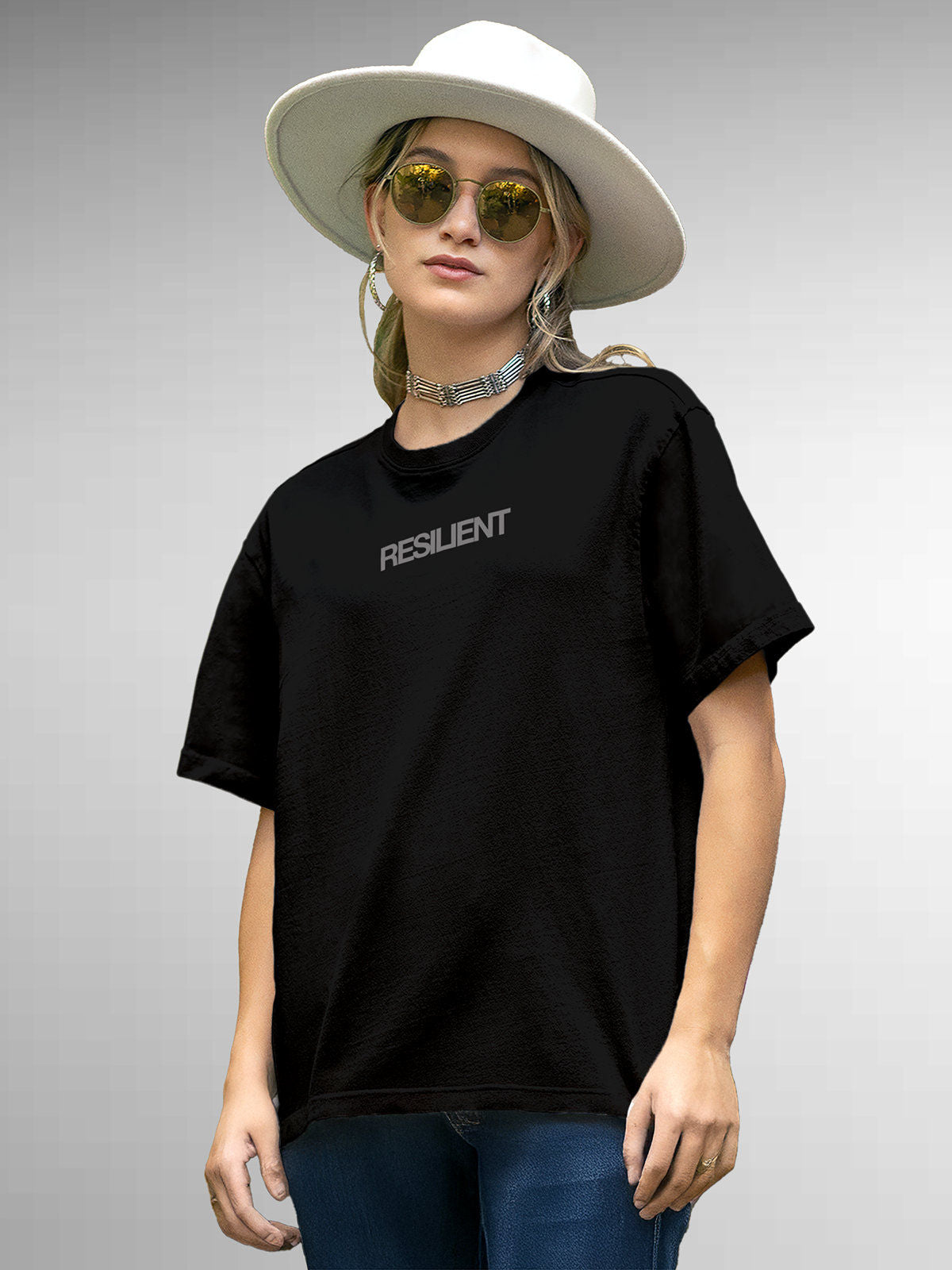 Model wearing Women's Black Round Neck T-shirt with 'Resilient' design, offering effortless style and premium comfort
