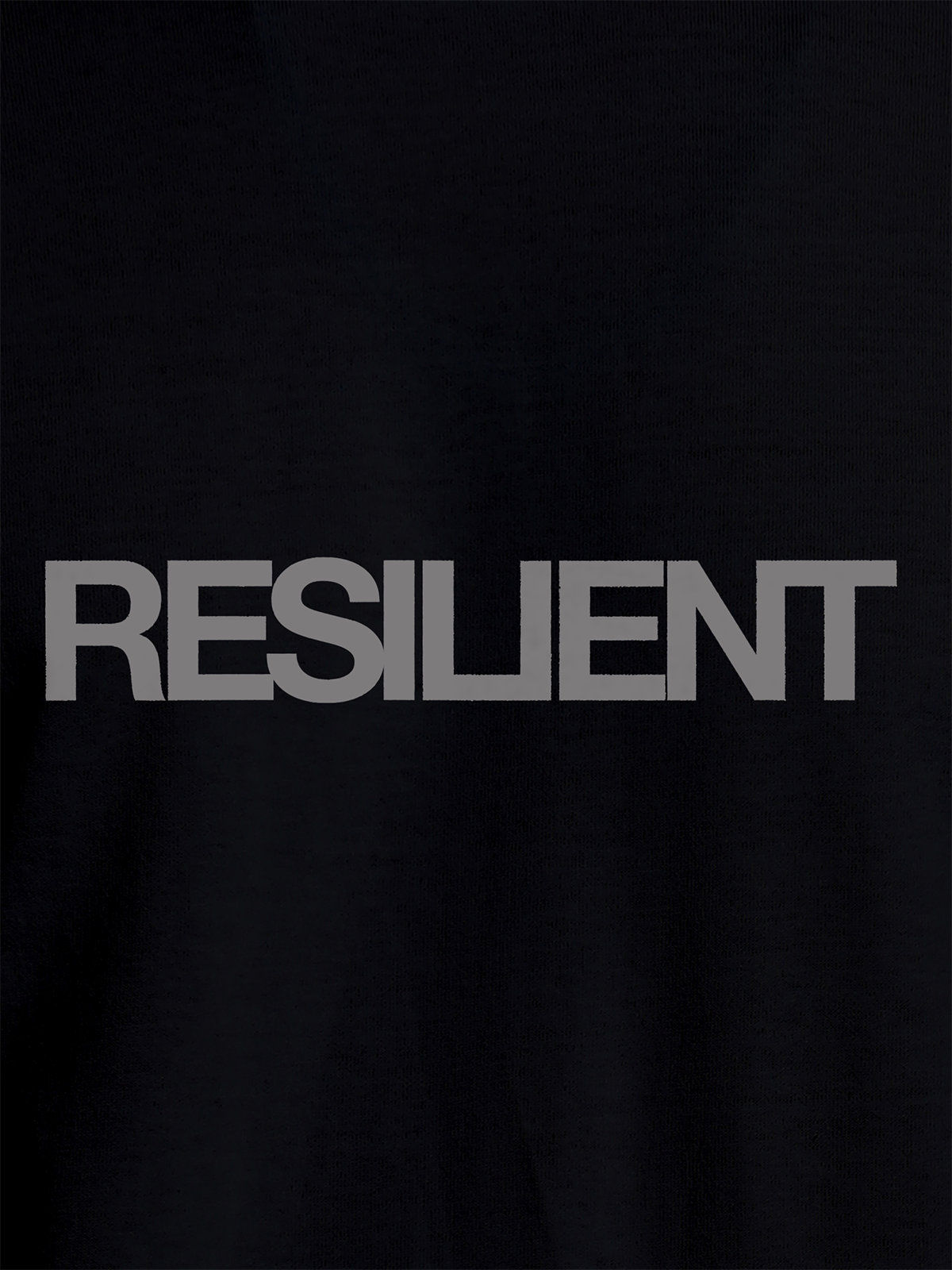 Close up of 'Resilient' design on Women's Black Round Neck T-shirt, highlighting intricate details and vibrant print.