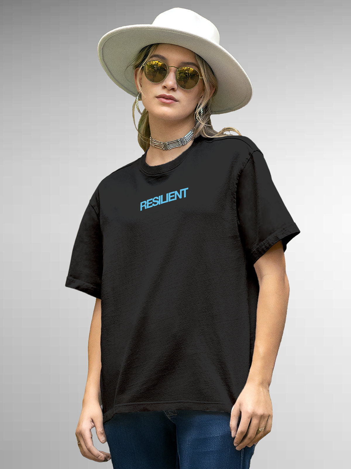 Model wearing Women's Dark Grey Round Neck T-shirt with 'Resilient' design, offering effortless style and premium comfort