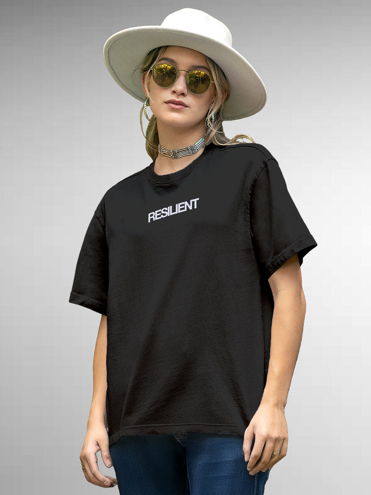 Model wearing Women's Dark Grey Round Neck T-shirt with 'Resilient' design, offering effortless style and premium comfort