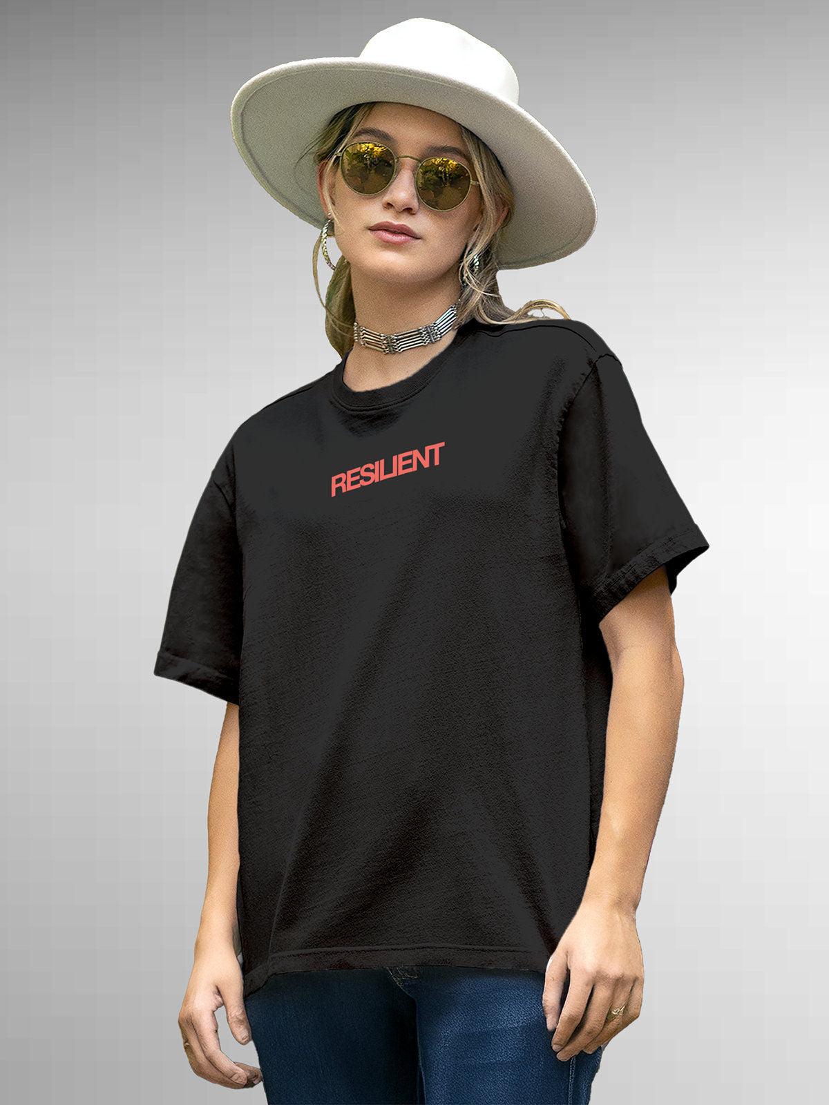 Model wearing Women's Dark Grey Round Neck T-shirt with 'Resilient' design, offering effortless style and premium comfort