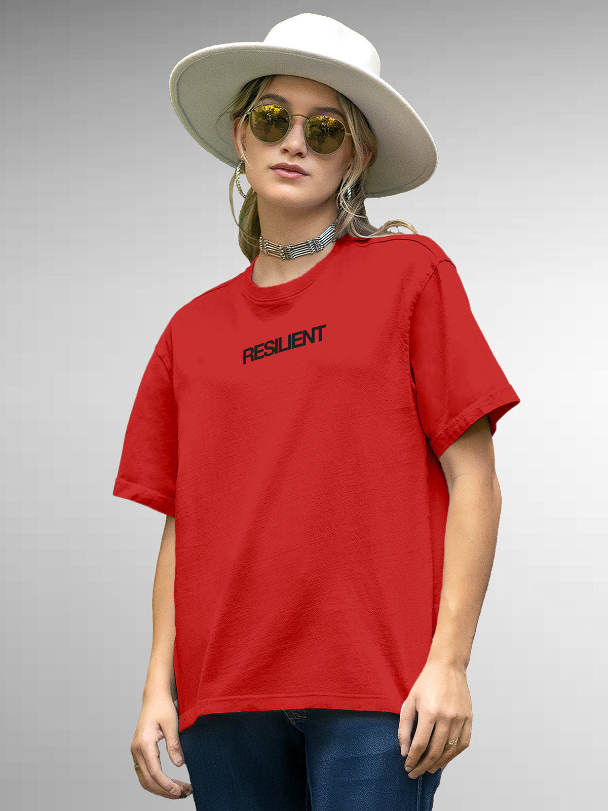 Model wearing Women's Red Round Neck T-shirt with 'Resilient' design, offering effortless style and premium comfort