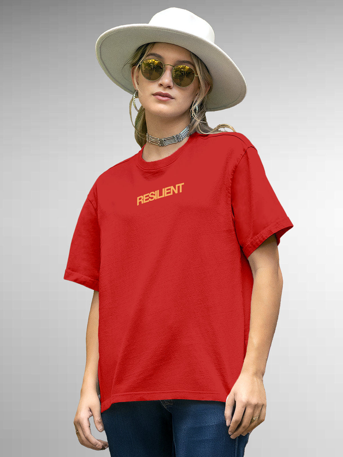 Model wearing Women's Red Round Neck T-shirt with 'Resilient' design, offering effortless style and premium comfort