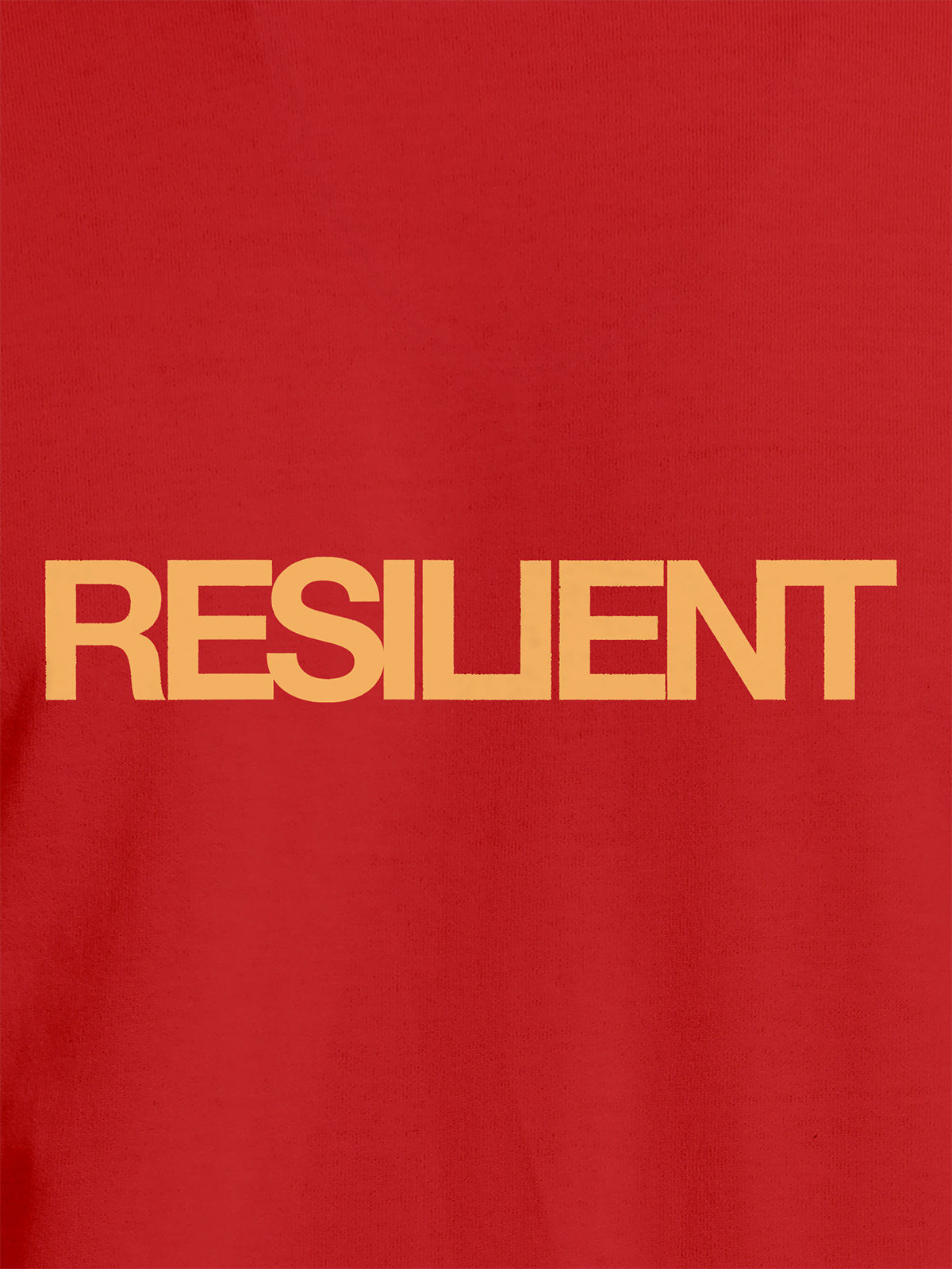 Close up of 'Resilient' design on Women's Red Round Neck T-shirt, highlighting intricate details and vibrant print.