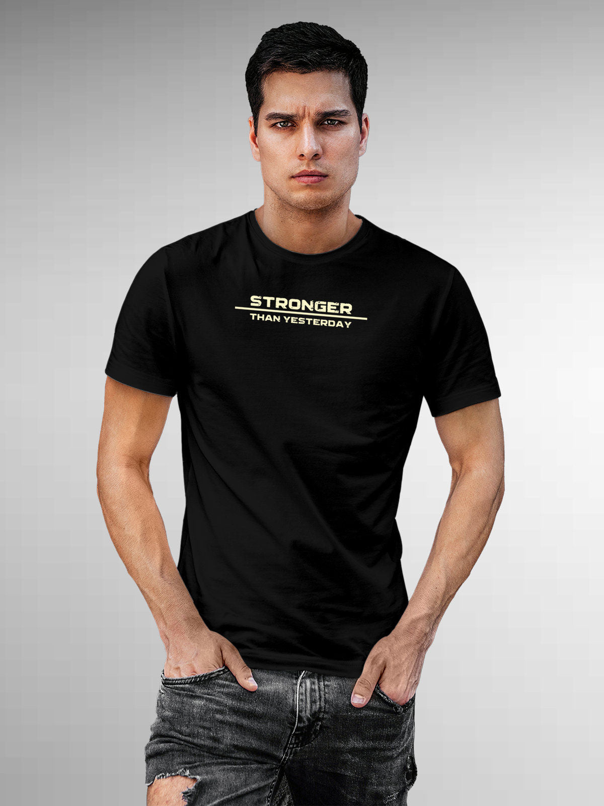 Model wearing Men's Black Round Neck T-shirt with 'Stronger Than Yesterday' design, offering effortless style and premium comfort
