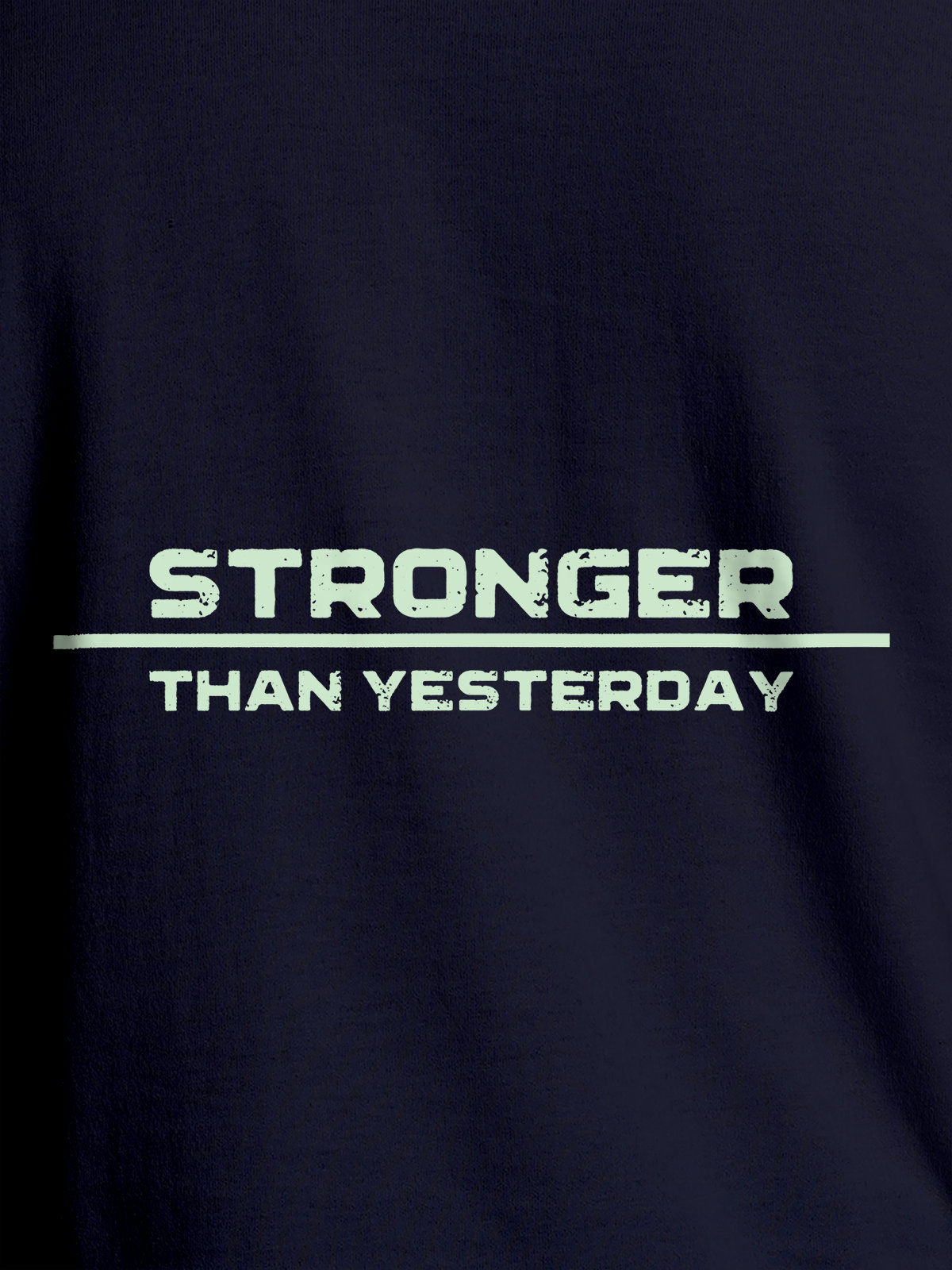 Close up of 'Stronger Than Yesterday' design on Men's Navy Blue Round Neck T-shirt, highlighting intricate details and vibrant print.